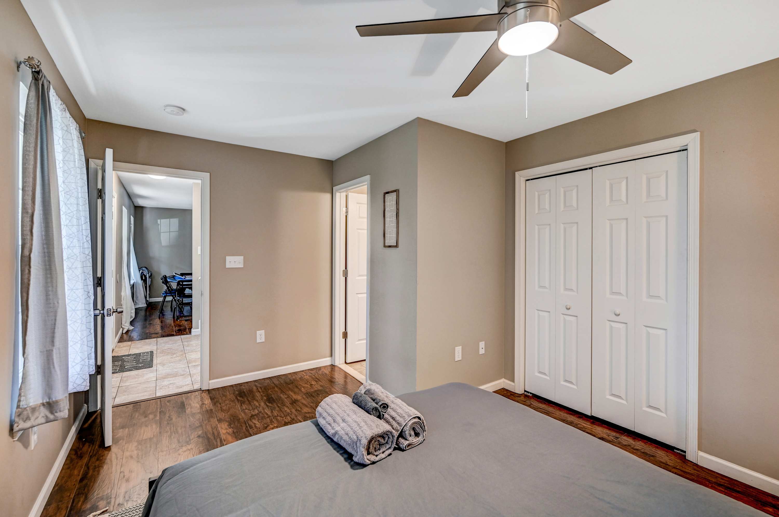 Your Cozy Retreat Awaits! Unwind in this stylish and serene bedroom, complete with warm lighting, modern decor, and a private ensuite for ultimate convenience.