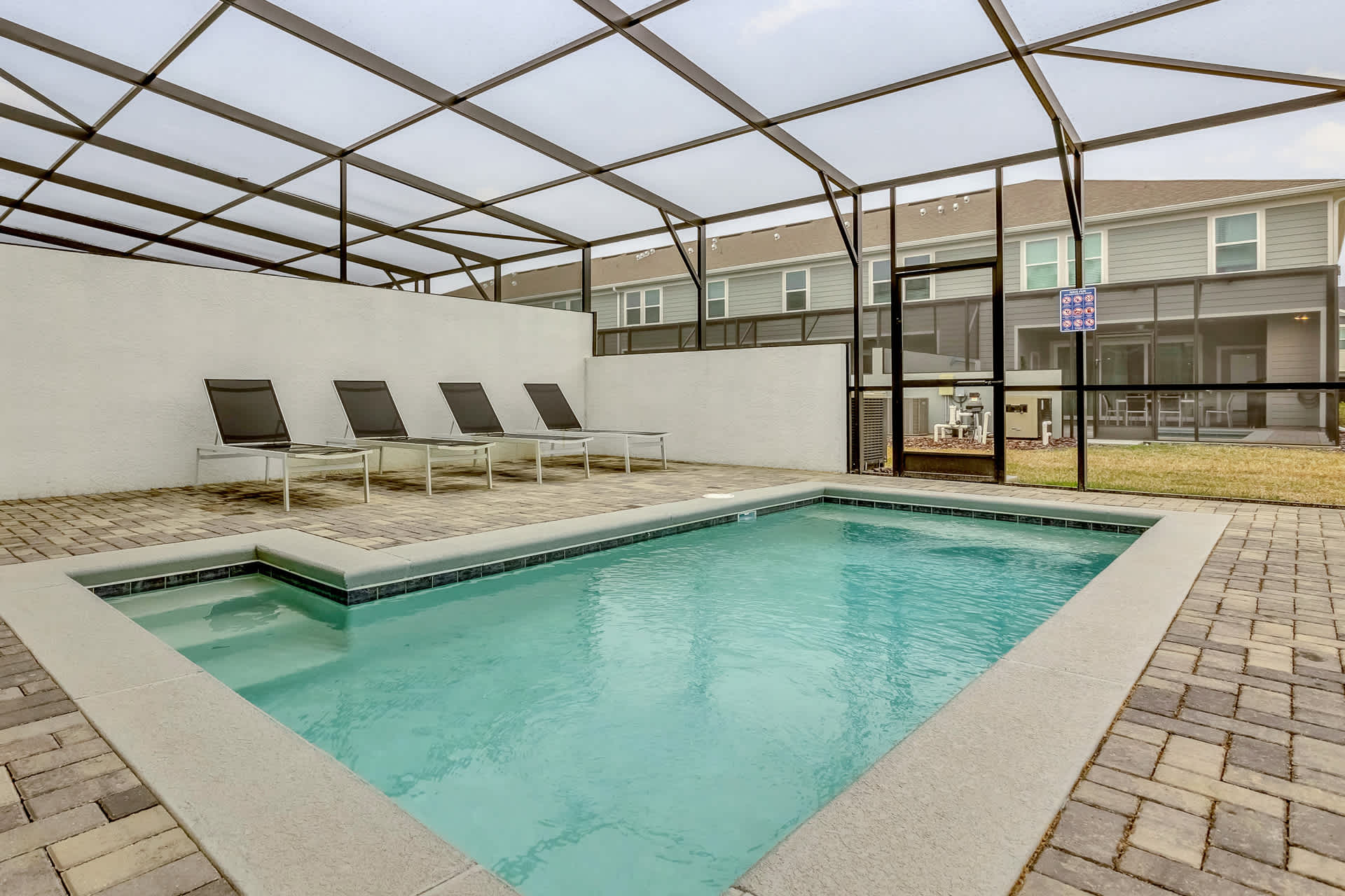 Outdoor Pool Area with Sun Loungers