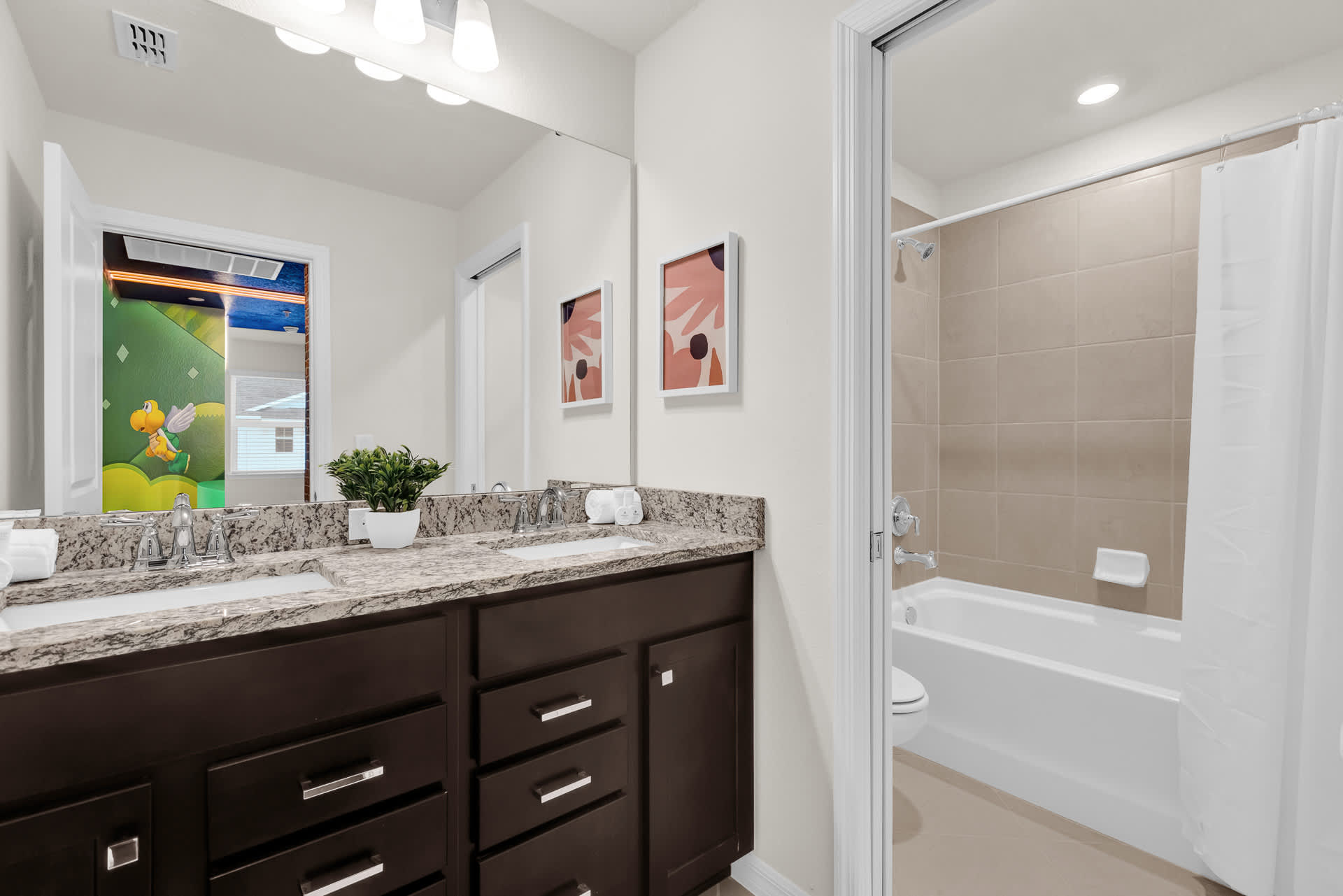 Full En-Suite Bathroom with Double Vanity and Combined Bathtub and Shower