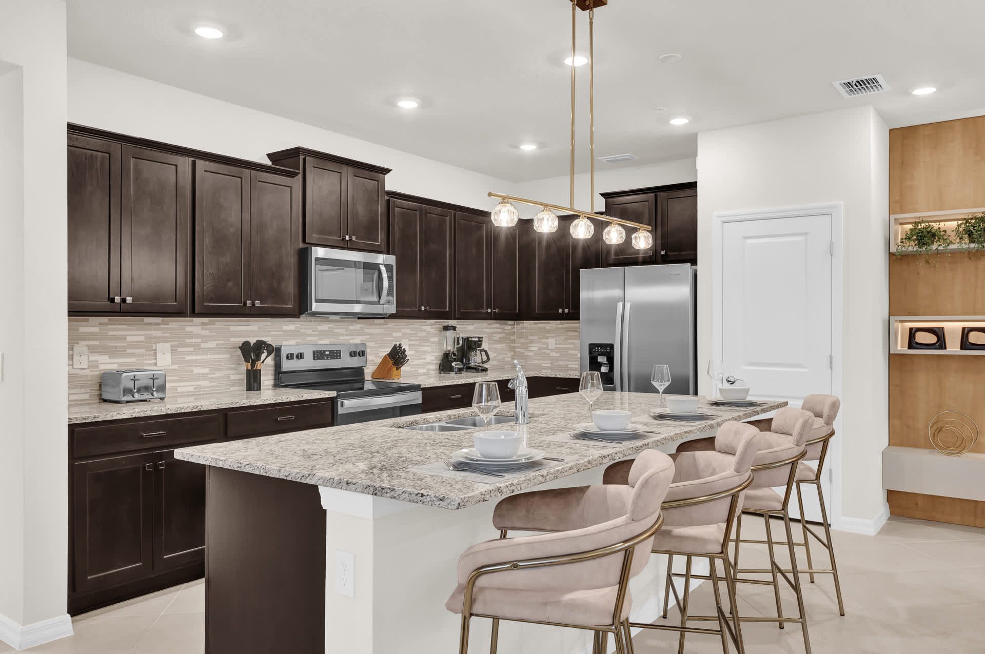 Fully Equipped Kitchen with Centered Island and Bar Stools