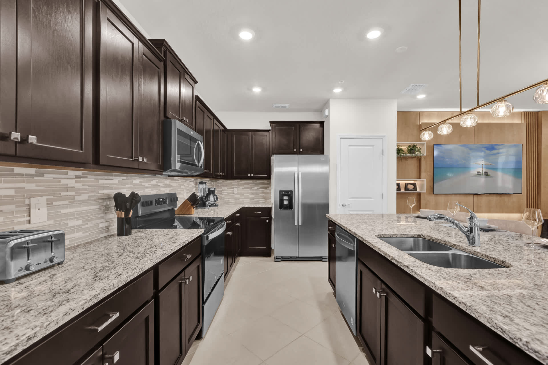 Modern Fully Equipped Kitchen with Silver Appliances