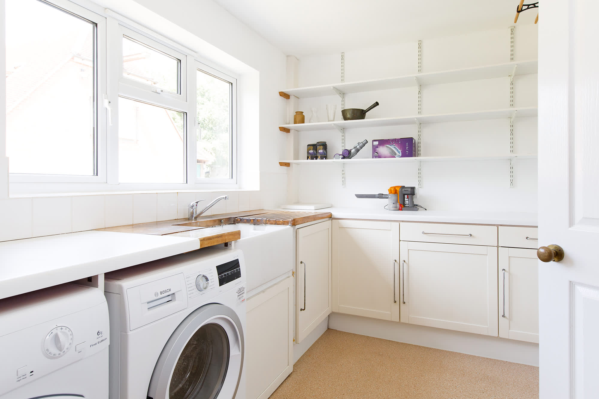 The large utility has a washer, dryer and plenty of room for sorting clothes and beach bags.