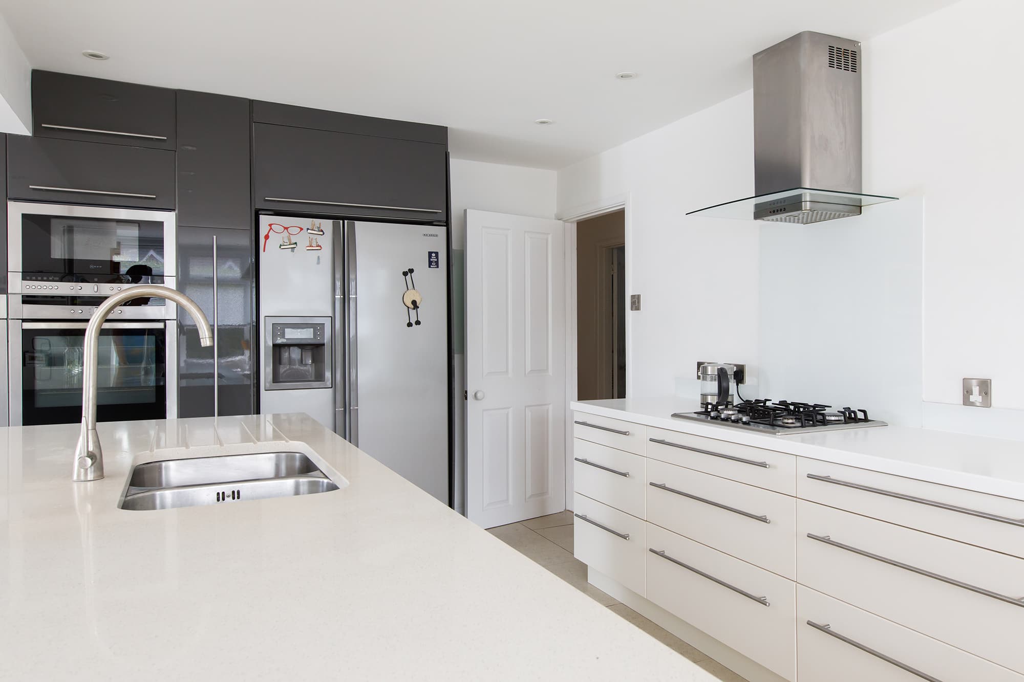 You have plenty of cupboard space and a huge American fridge freezer.