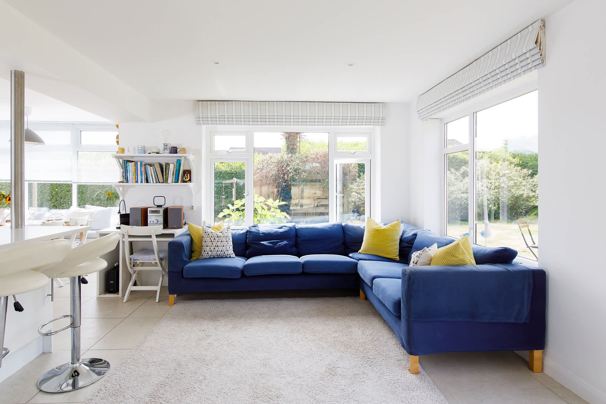 The open plan living space has a wonderful corner sofa, perfect for relaxing with a good book or cup of tea.