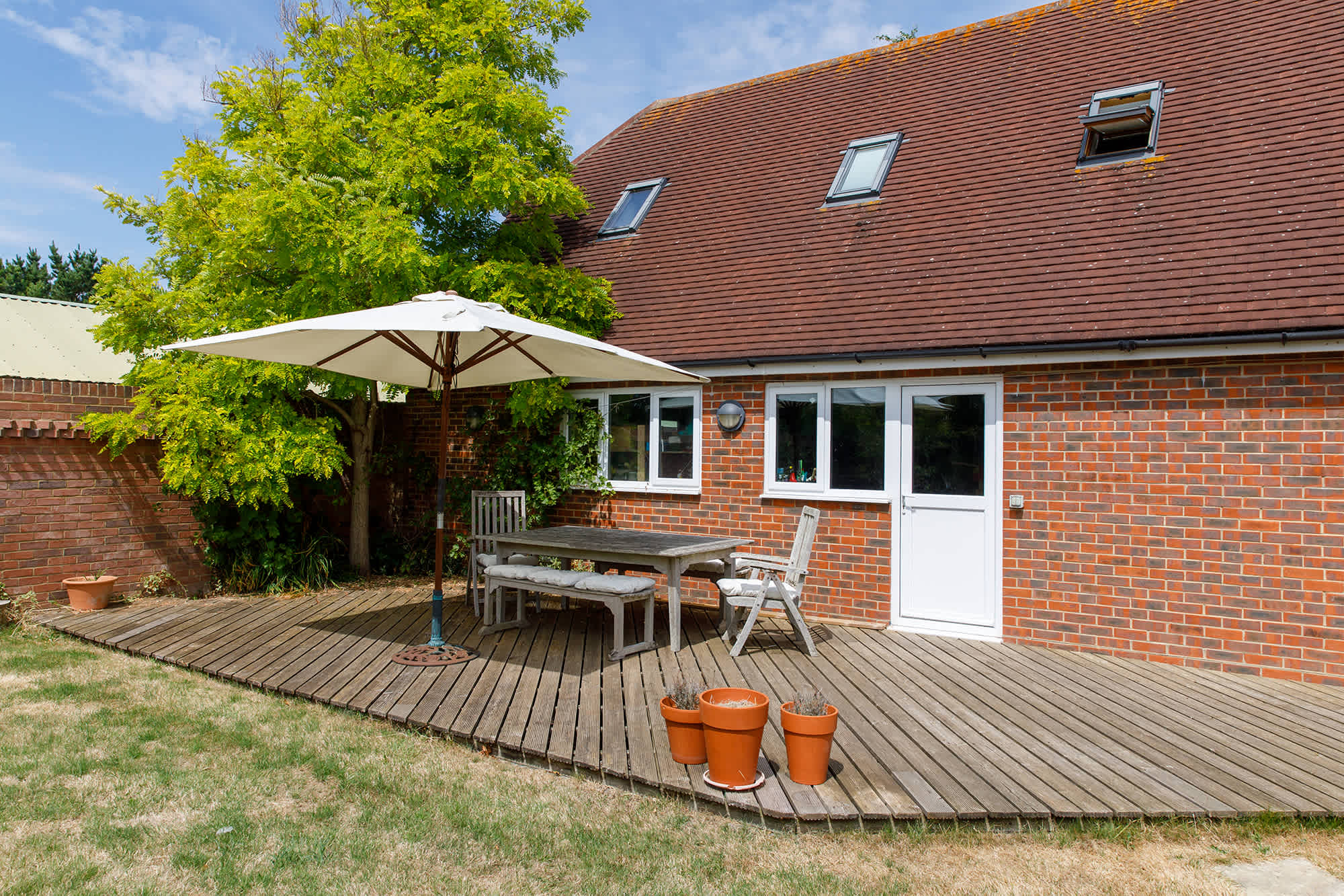 Enjoy two sunny patio areas in the garden.