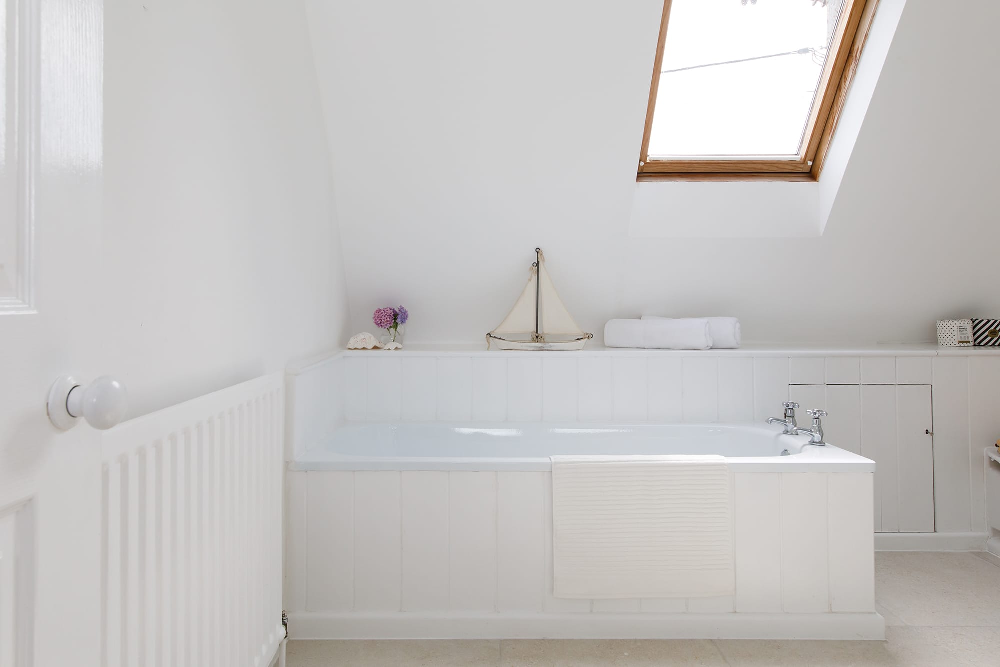 The beautiful family bathroom is spacious and modern.