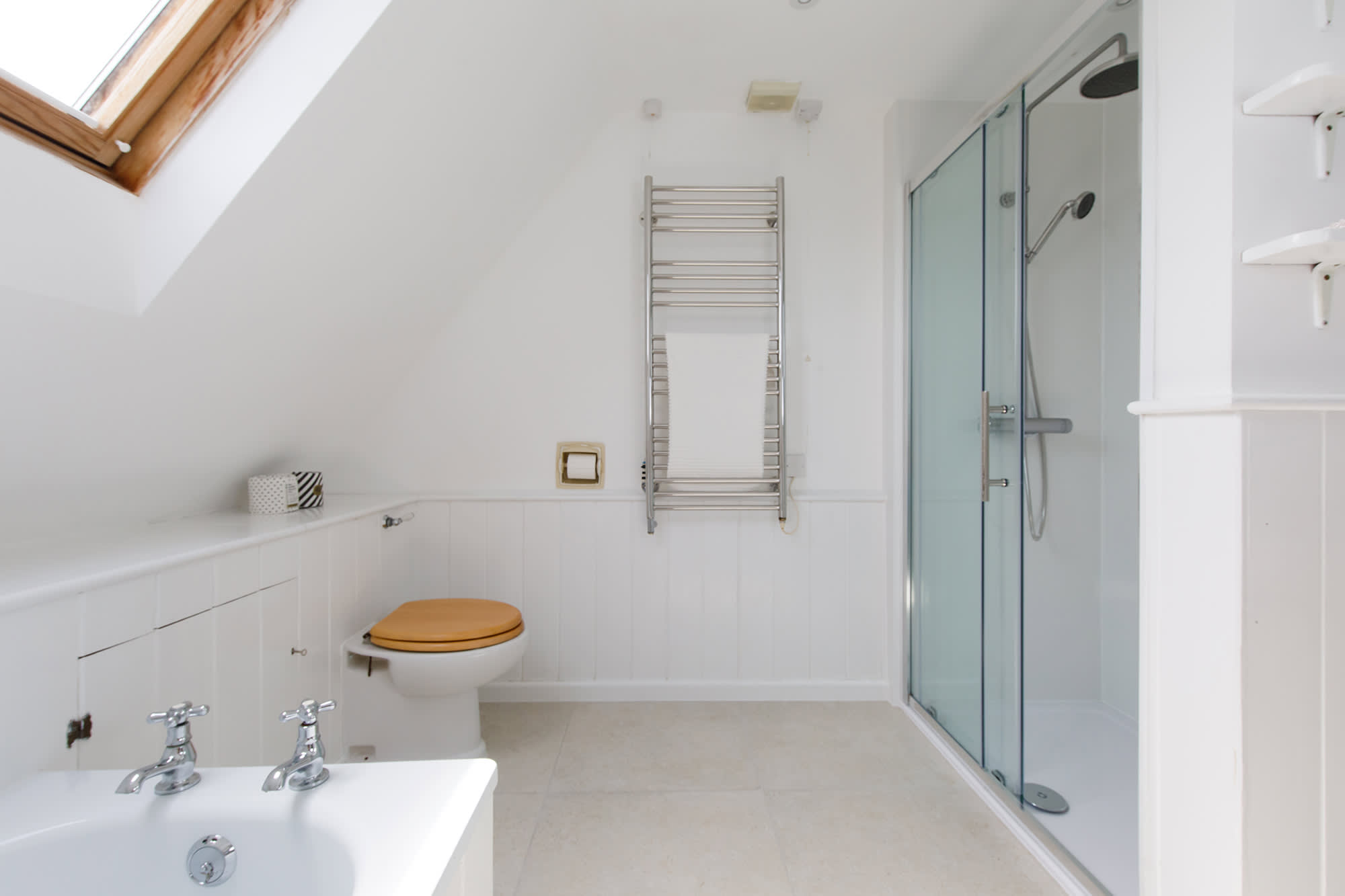 There is a bath and large separate, walk-in shower.