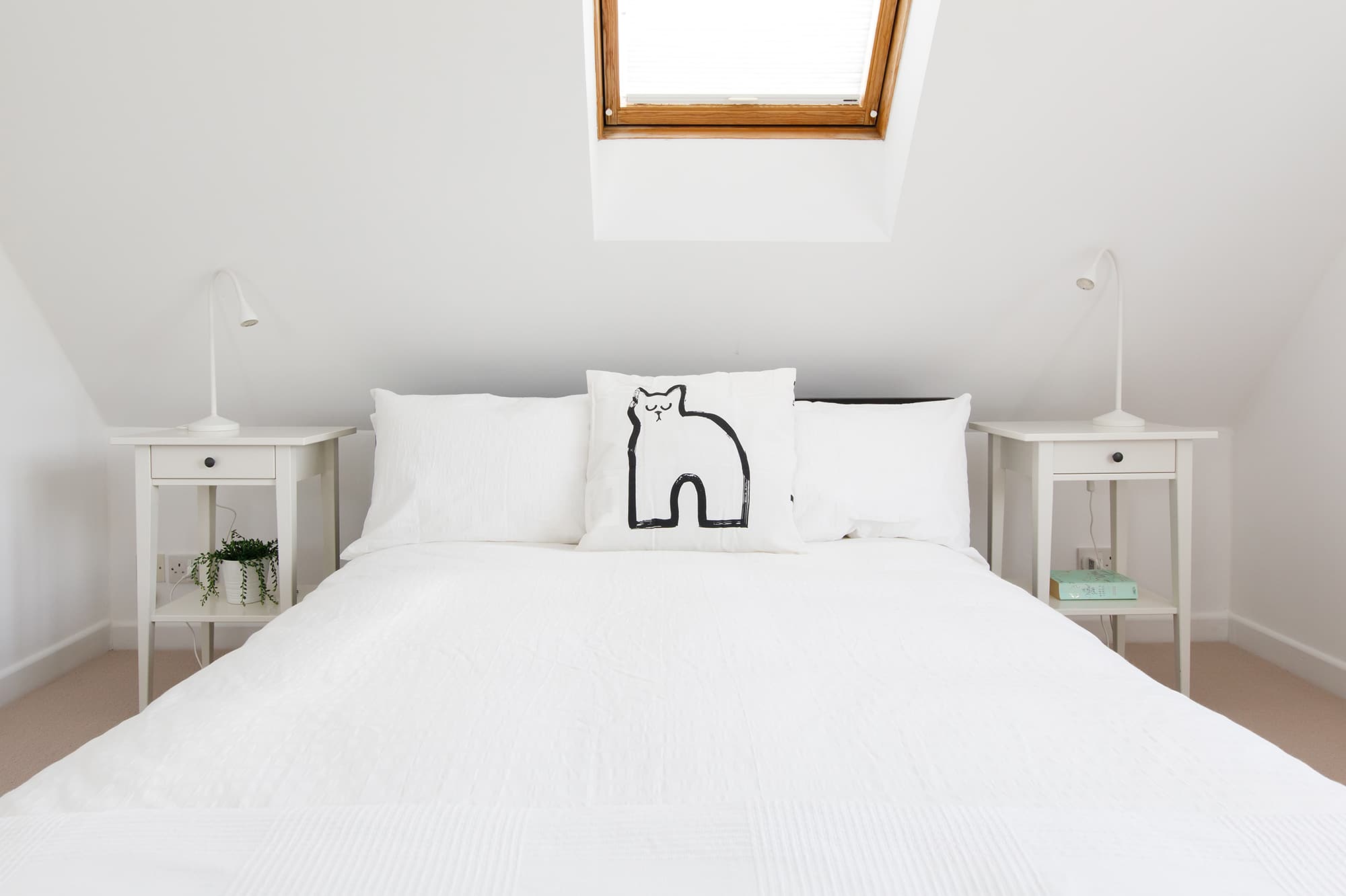 A further double room, with Velux windows, bedside tables and luxury bed linen.