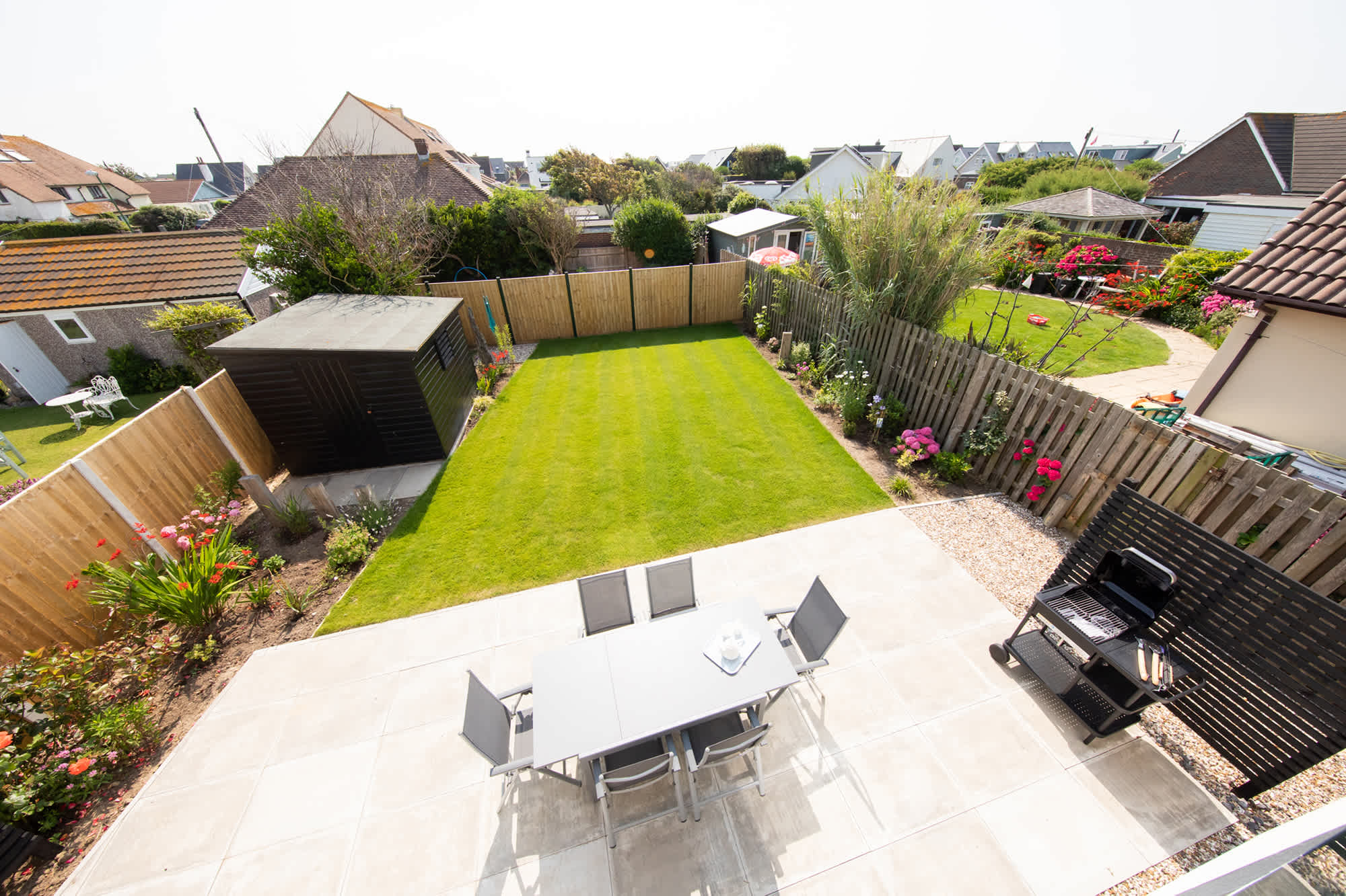 The Juliet balcony of the master bedroom overlooks the colourful garden