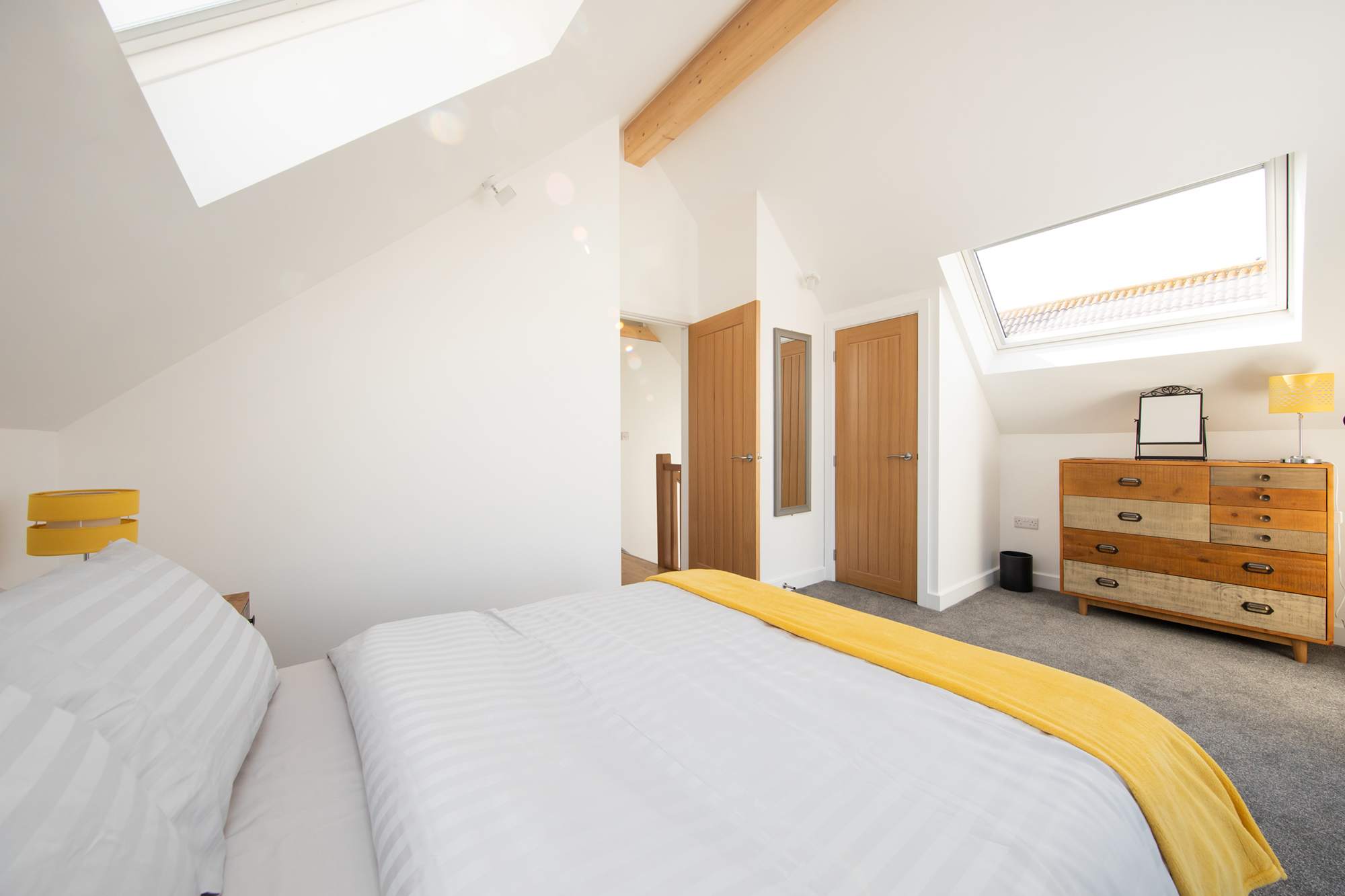 Artsy room with spacious drawers is perfect for keeping your clothes wrinkle-free.