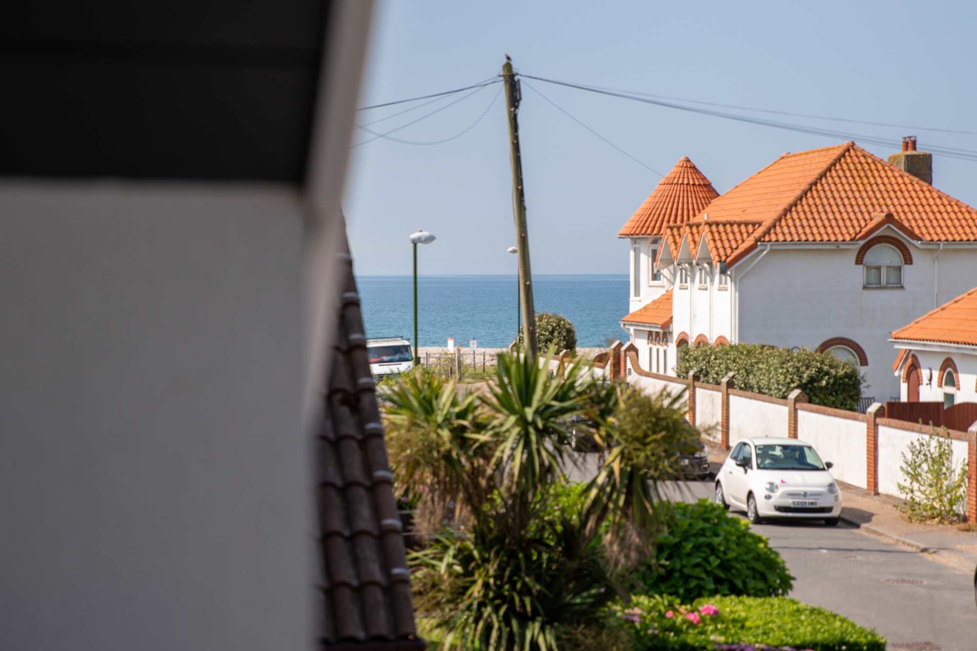 The home's prime location puts you just a couple of steps away from the beach. You can gaze at the sea from the upstairs balcony