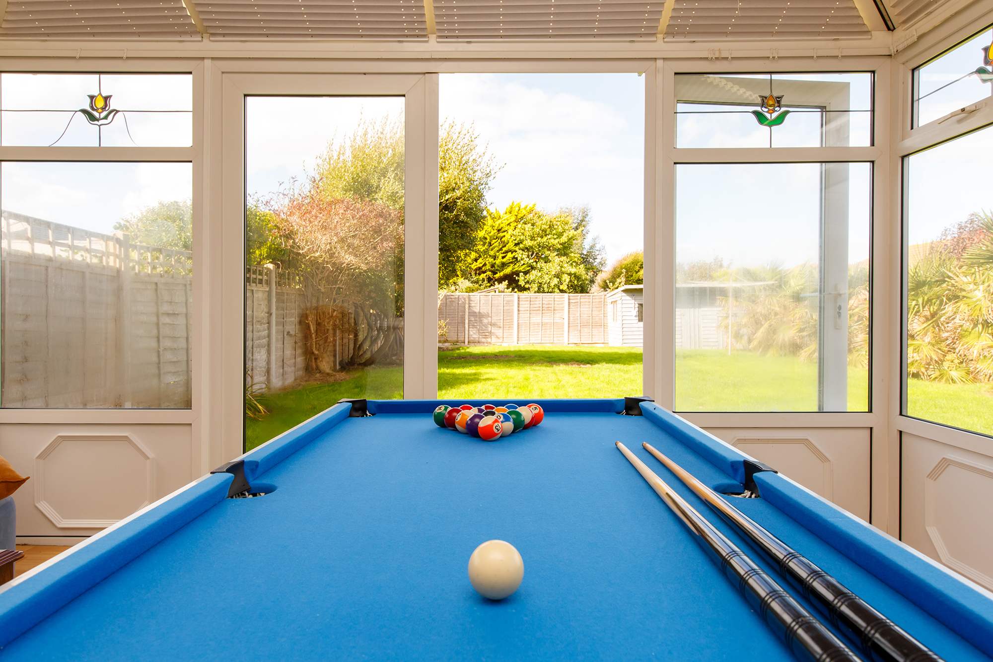 Rainy day? No problem! The conservatory has a pool table that converts into air hockey to keep everyone entertained.
