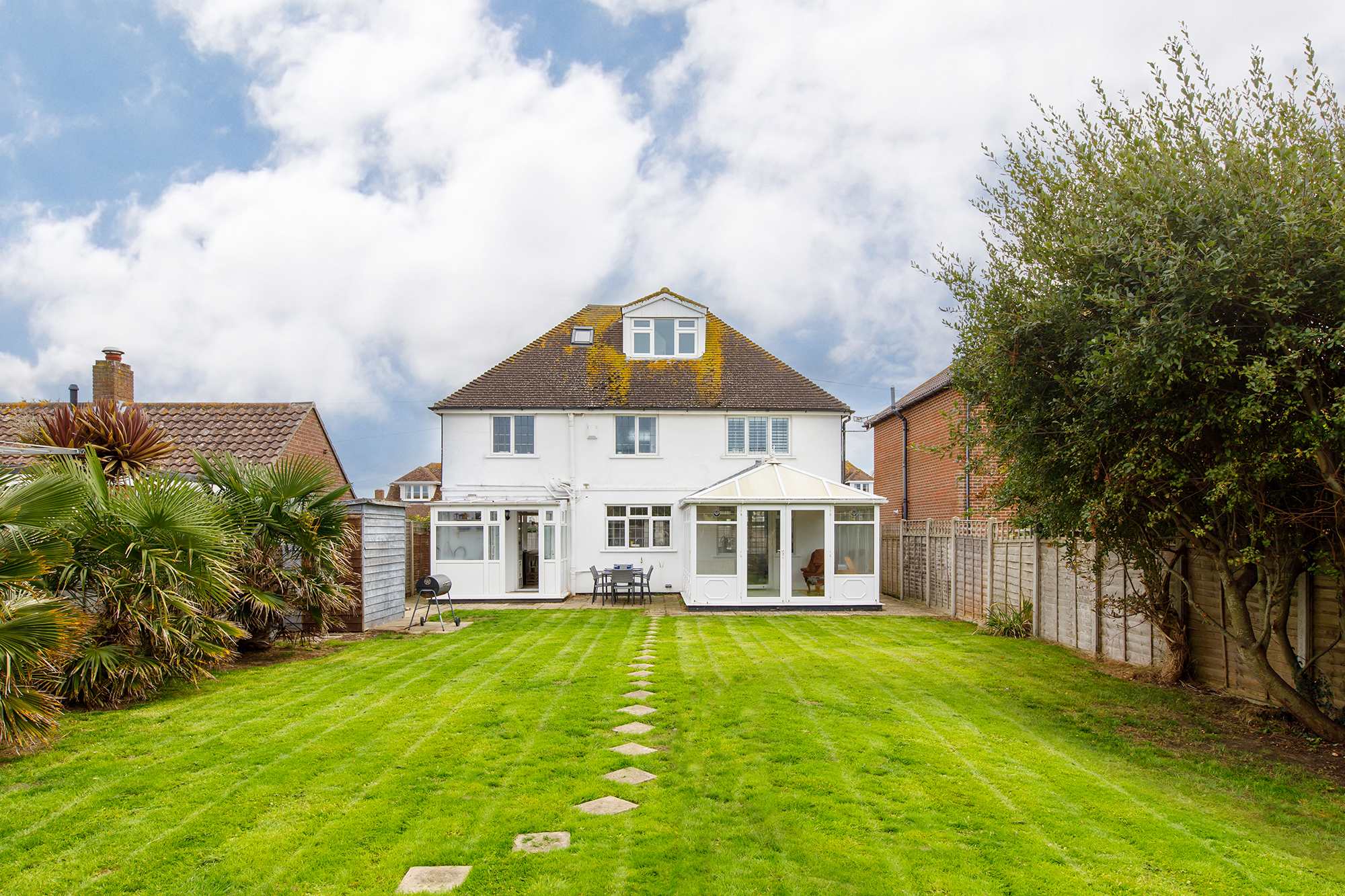 The spacious garden is perfect for ball games and other family fun.