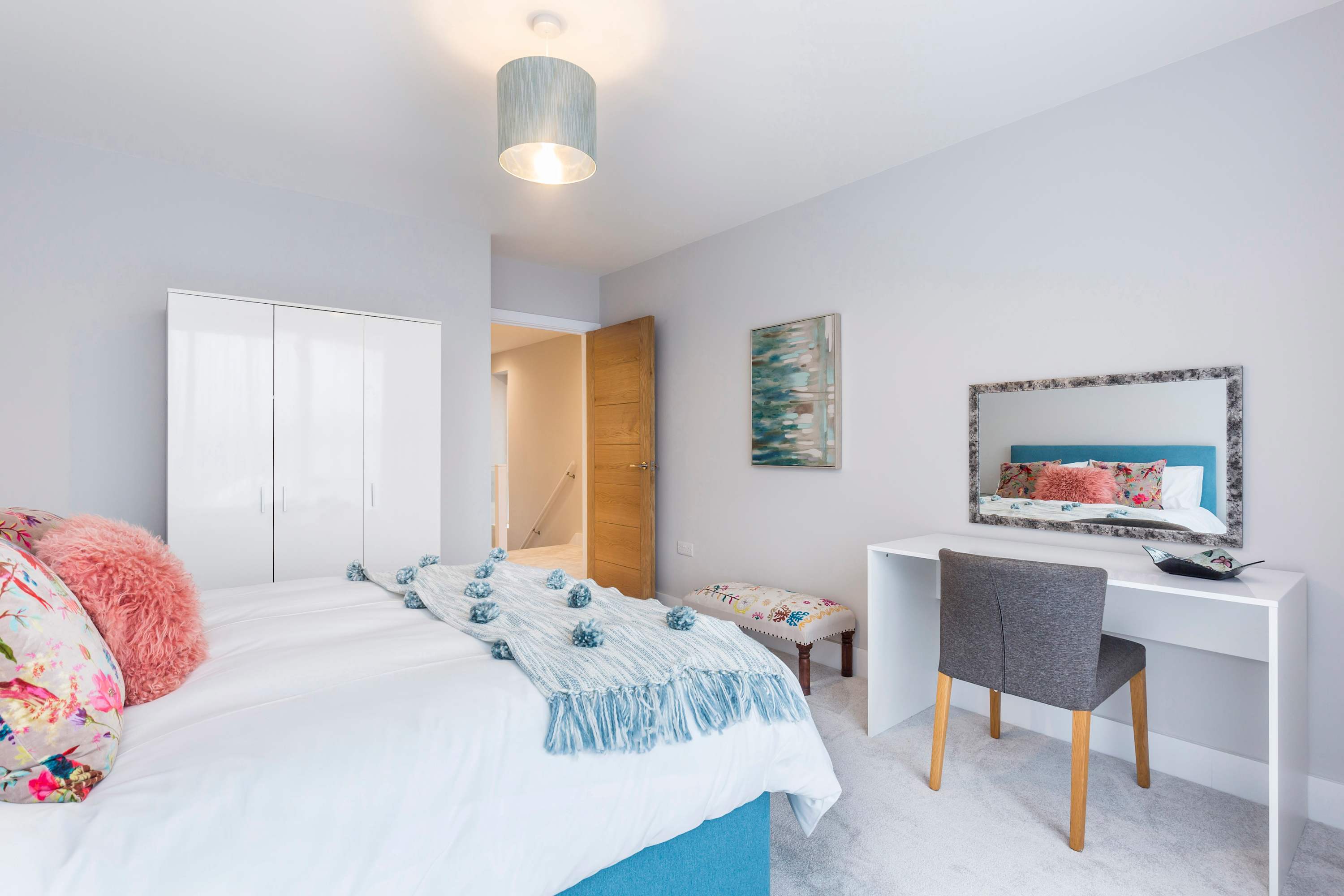 More style in this double bedroom w king bed