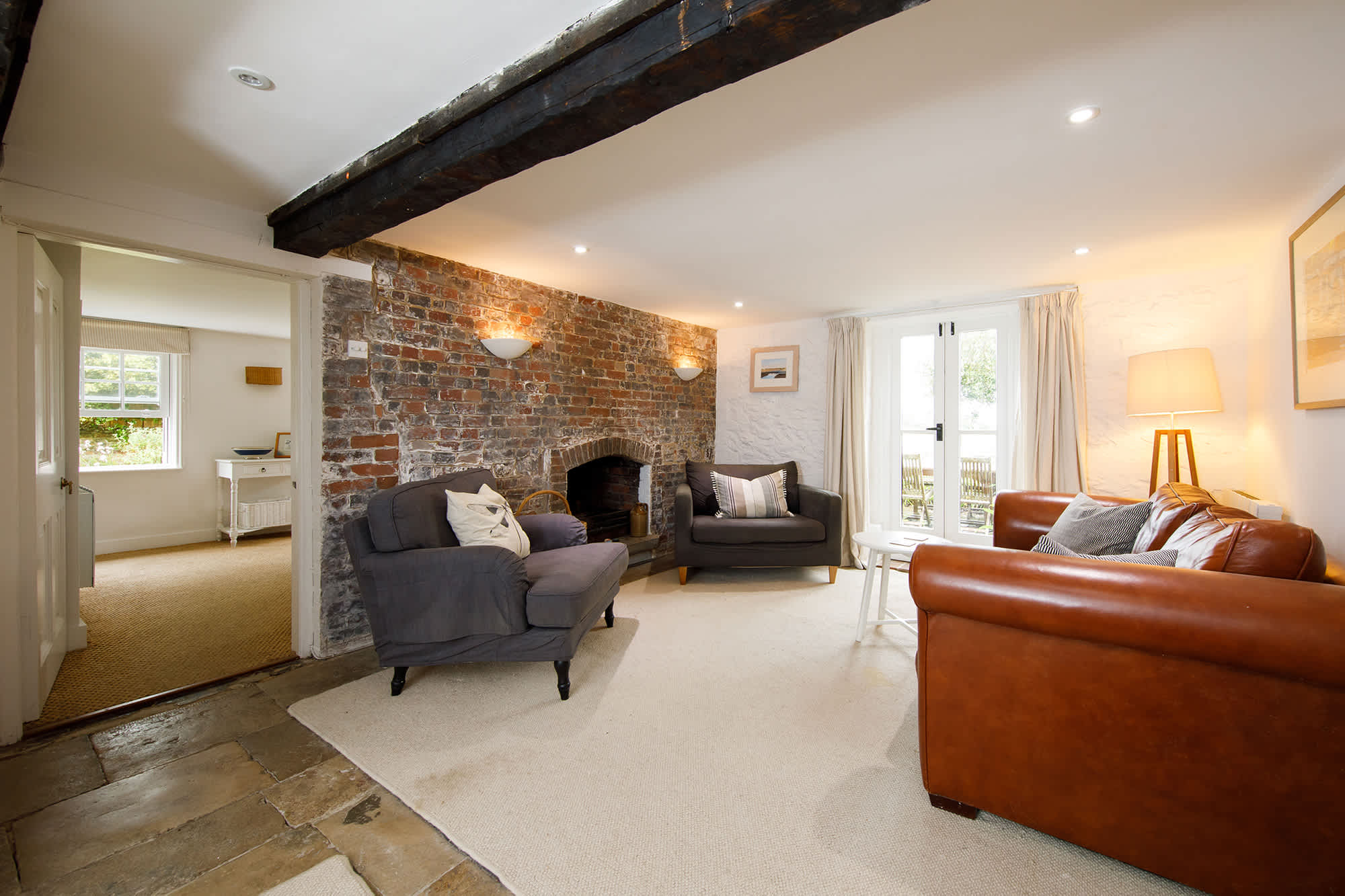 Wonderful lounge area surrounds the intimate brick fireplace
