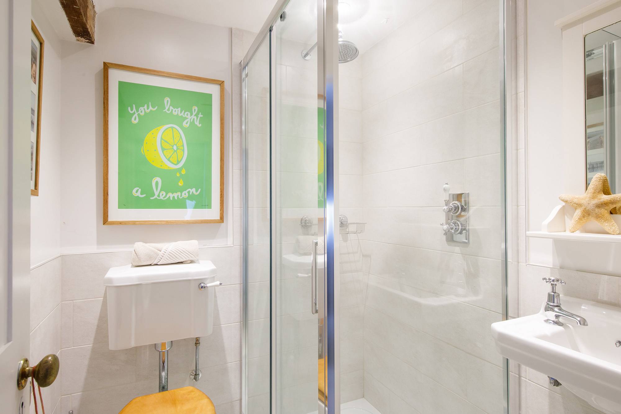 Unique décor colours the bathroom with a modern shower cabin