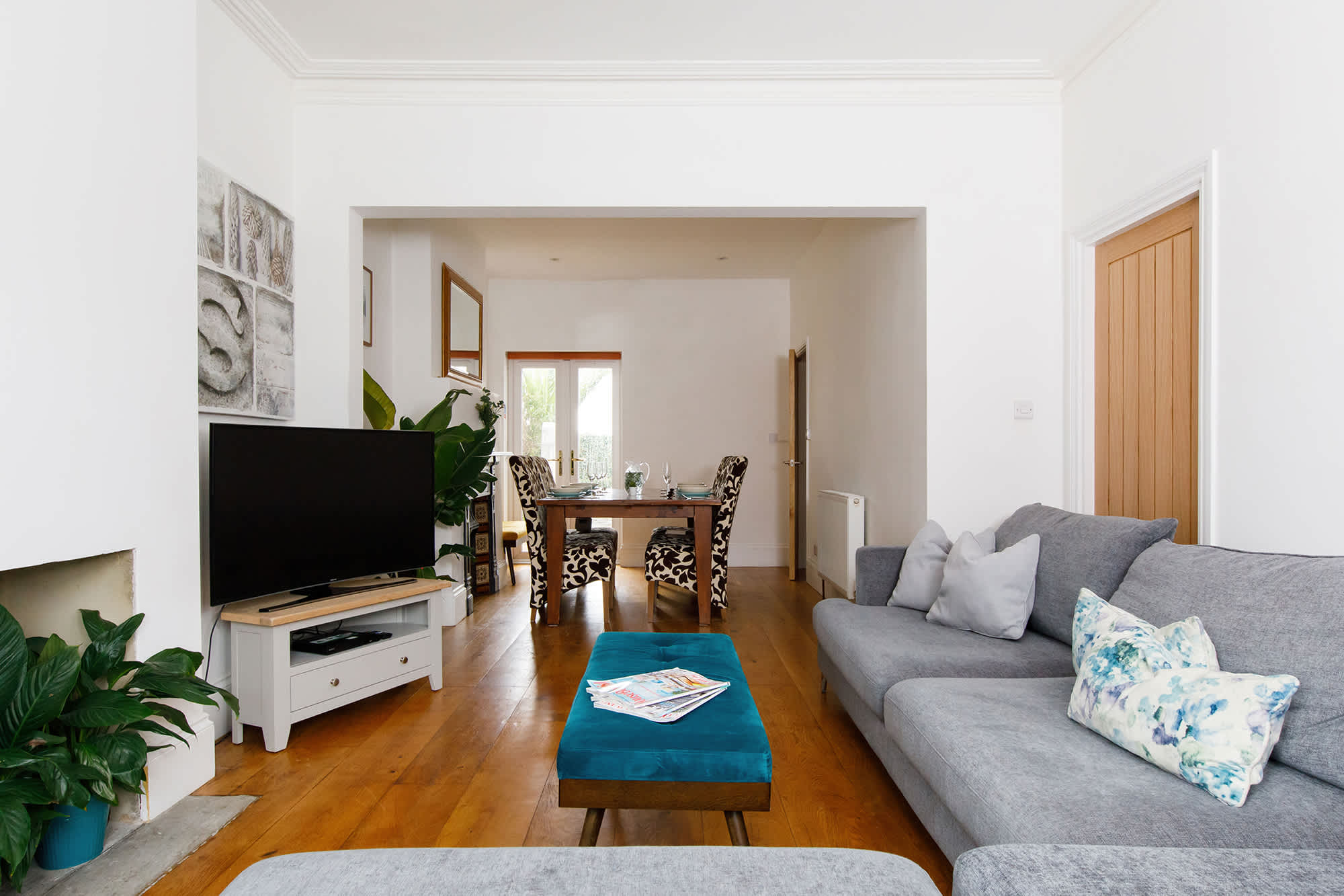 A formal – yet cozy – lounge area and elegant dining room with a feature fireplace.