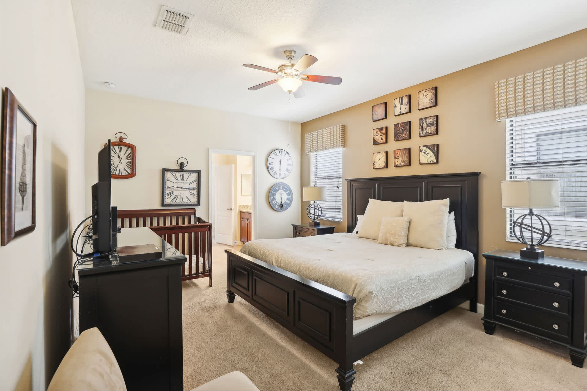 Spacious King bedroom with cot and TV