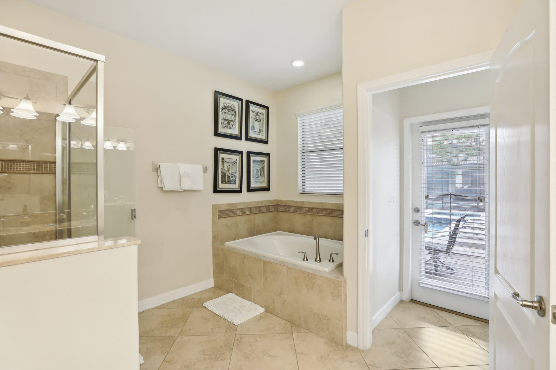 En-suite bathroom with standing shower and hot tub