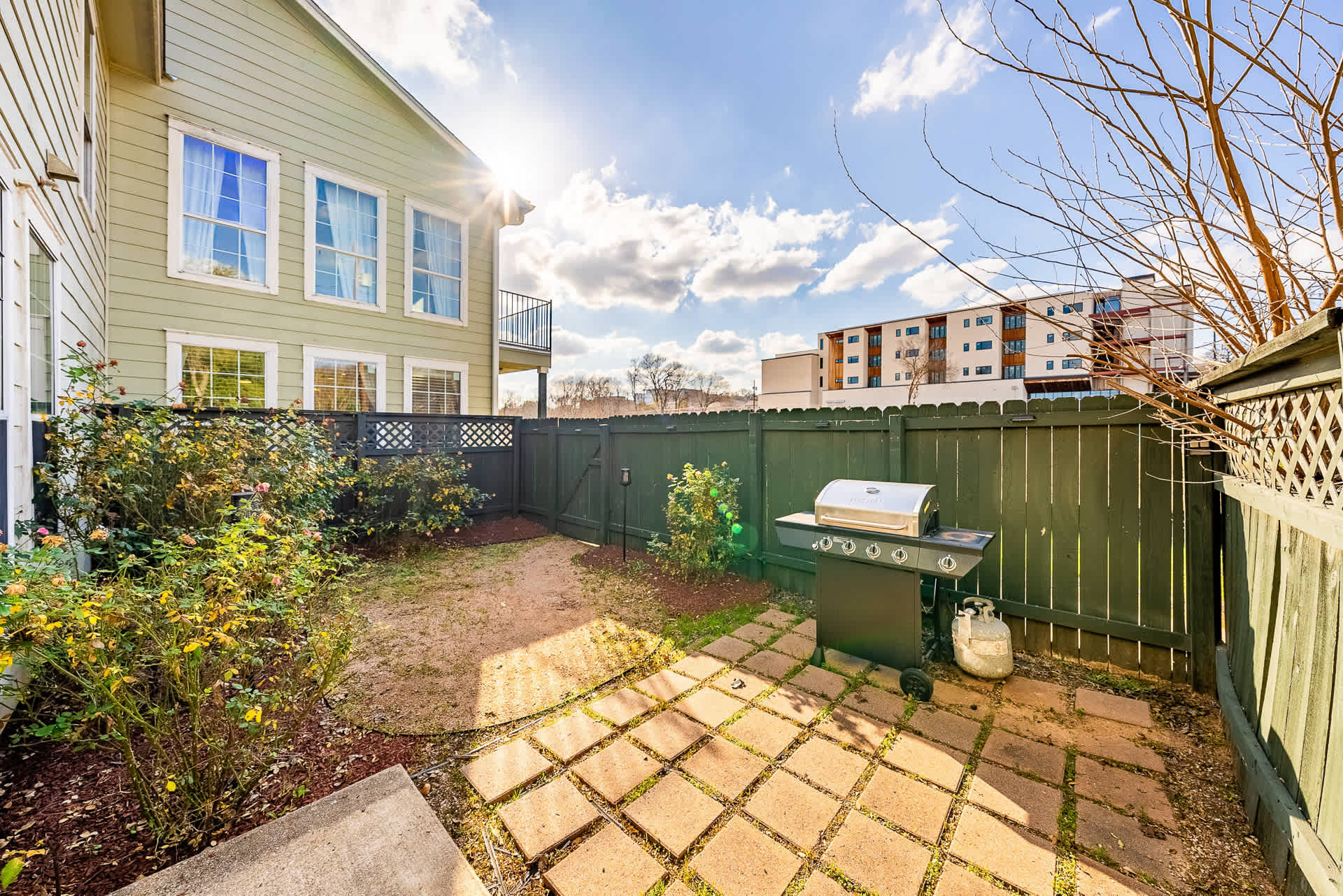 Outdoor garden area with BBQ grill