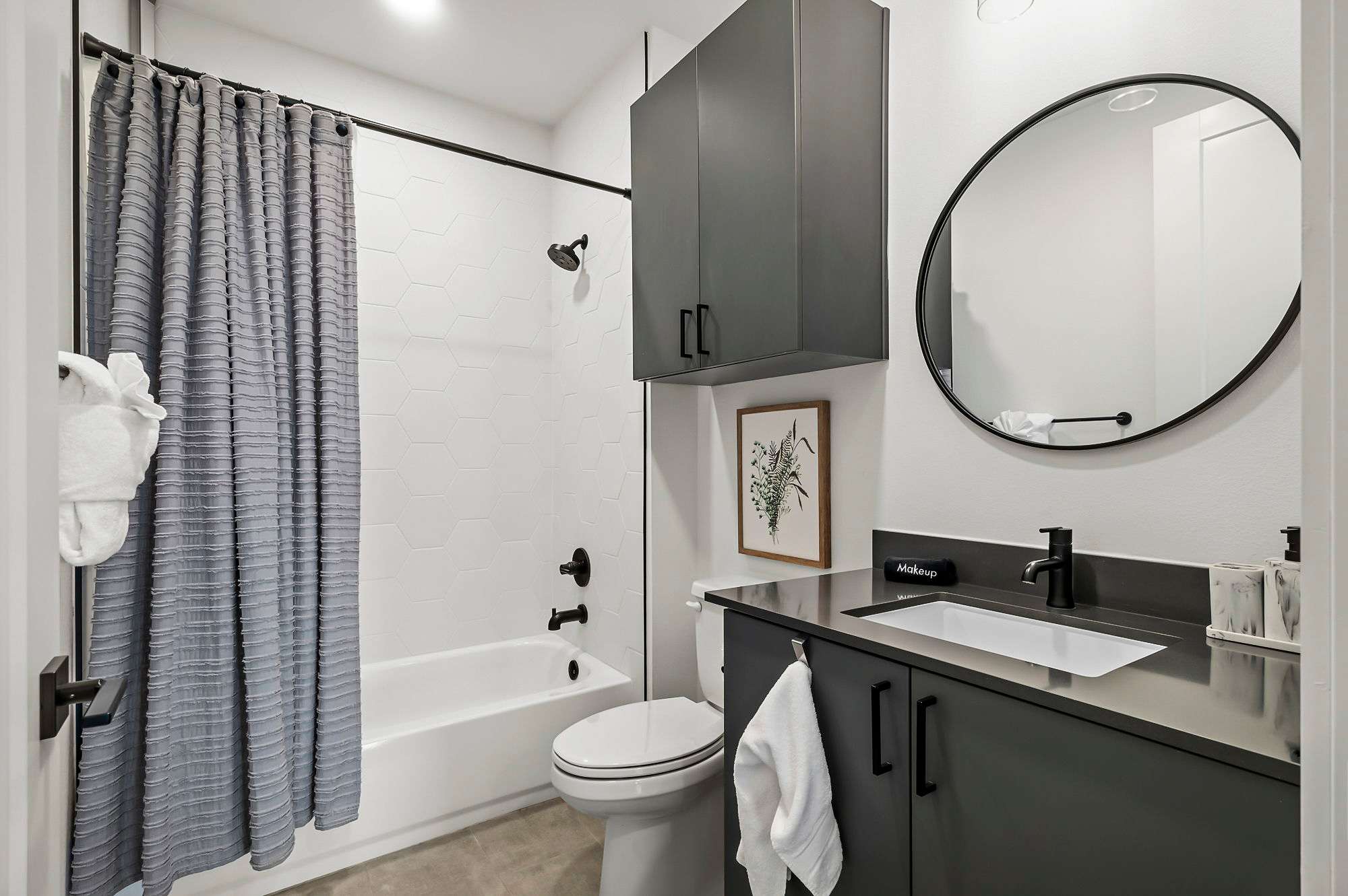Second bathroom with shower and tub combo
