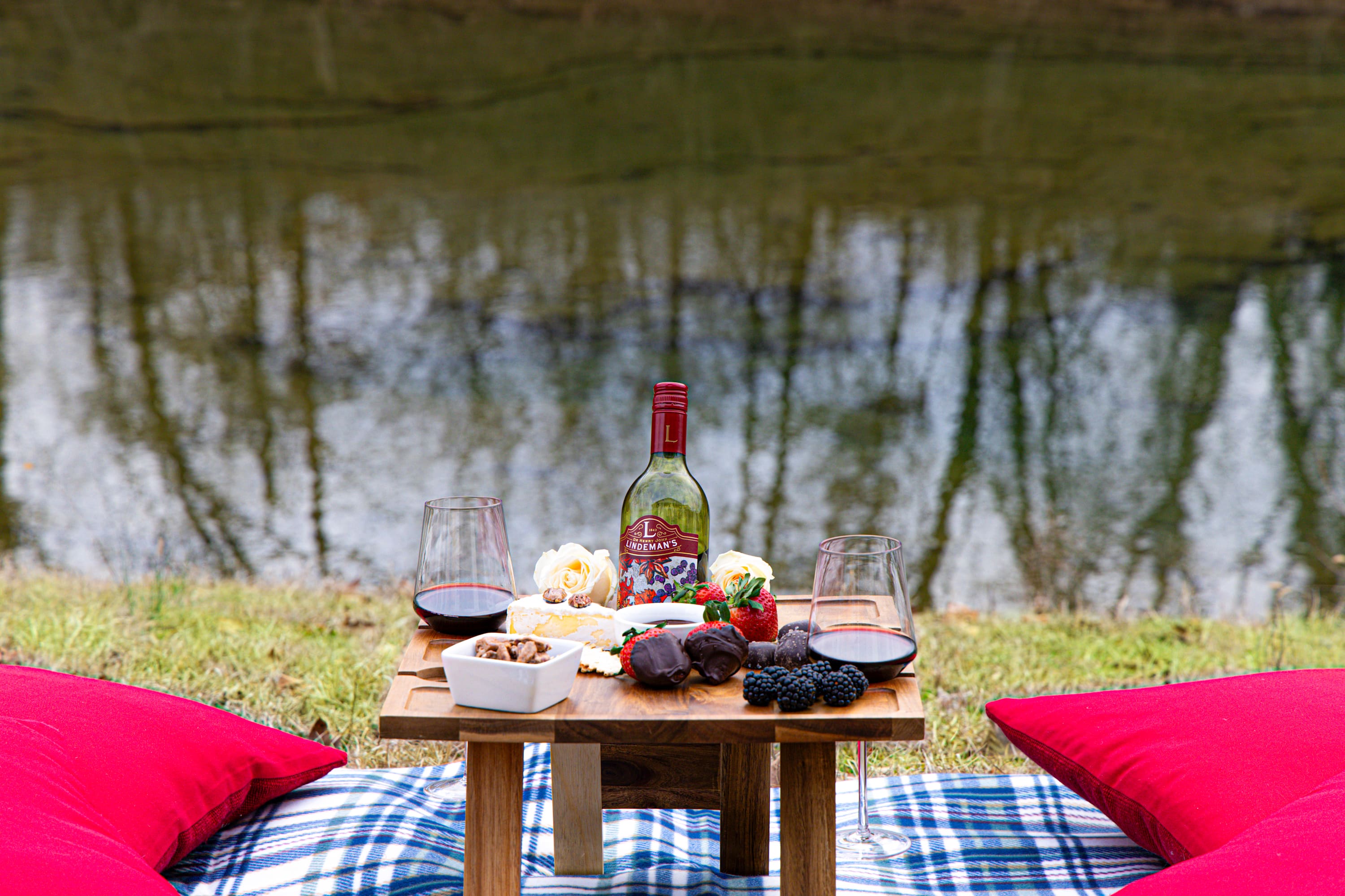 Looking for a break from all your adventures? Grab our outdoor picnic blanket & wine table to create the perfect creekside picnic.