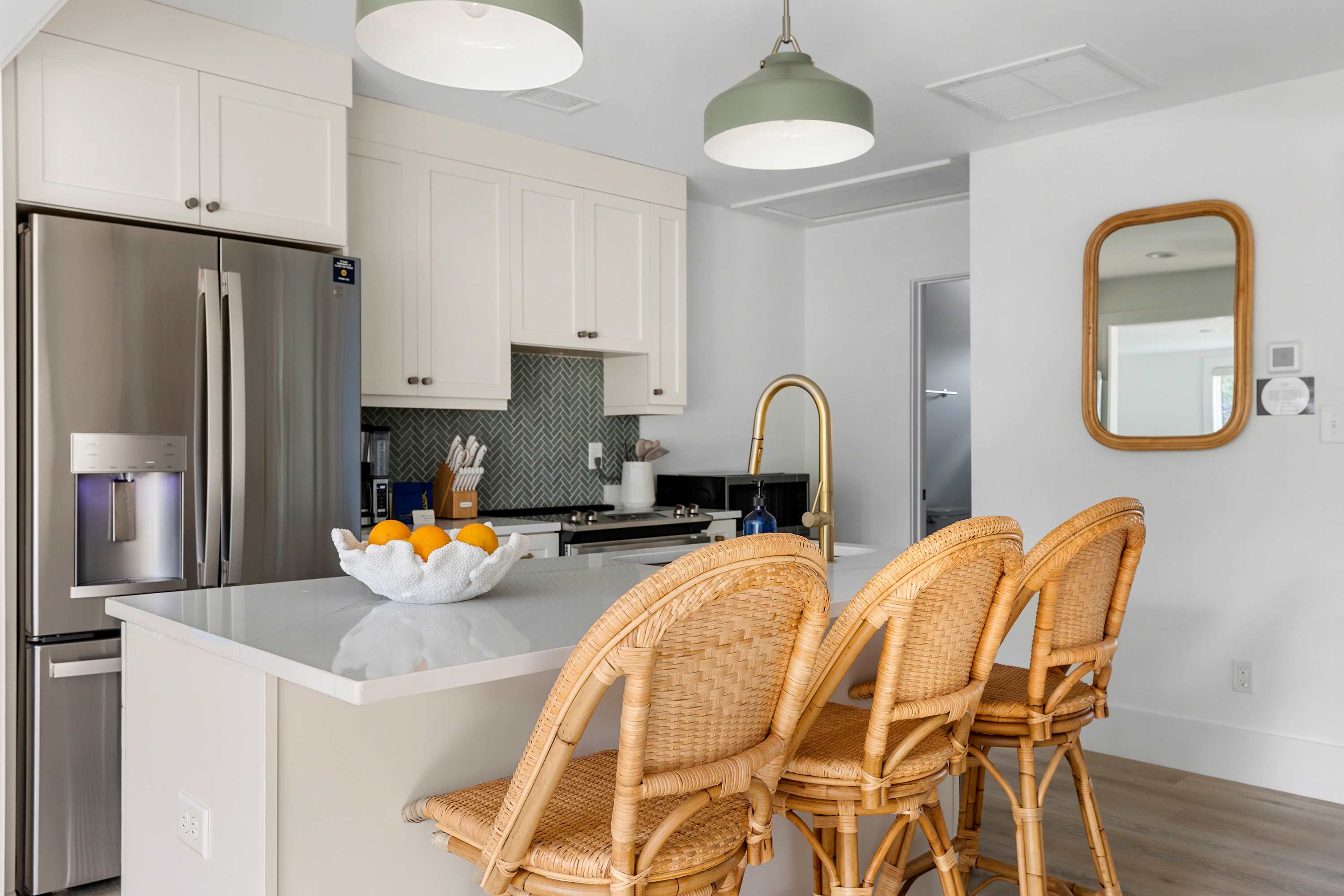 Fully equipped kitchen with everything you need to cook a meal and seating for three on the island!