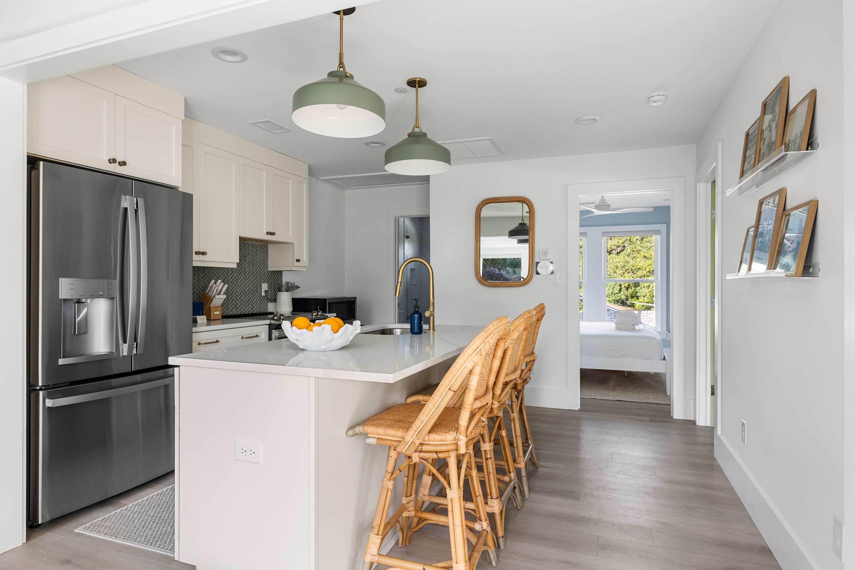 Fully equipped kitchen with everything you need to cook a meal and seating for three on the island!