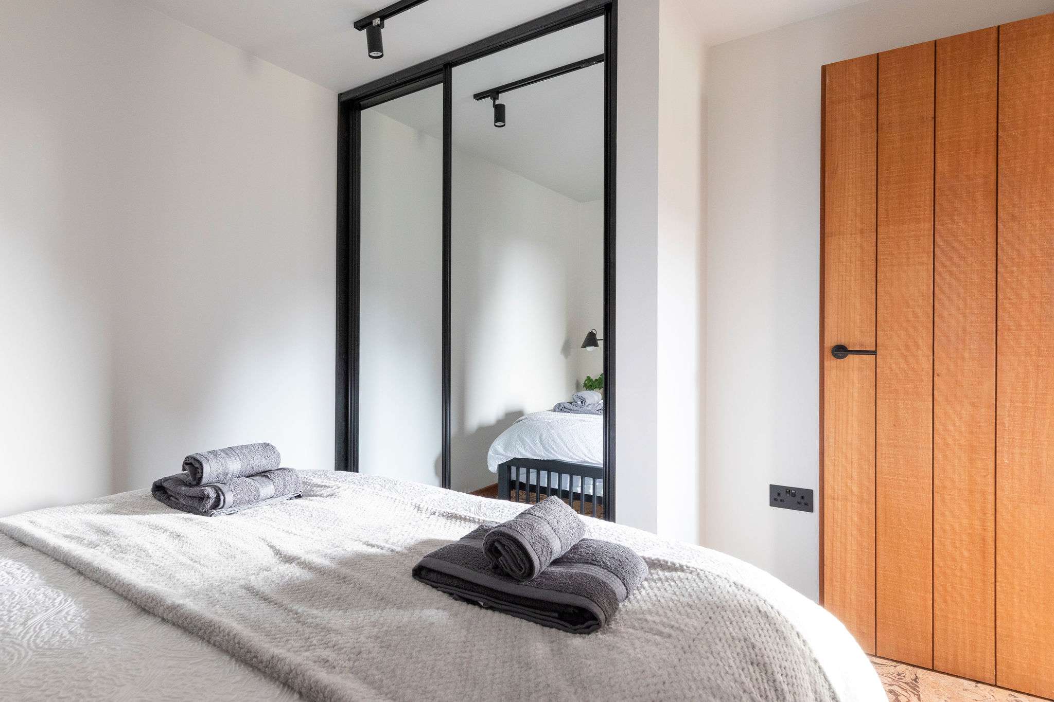 A double large mirrored wardrobe to store your belongings.