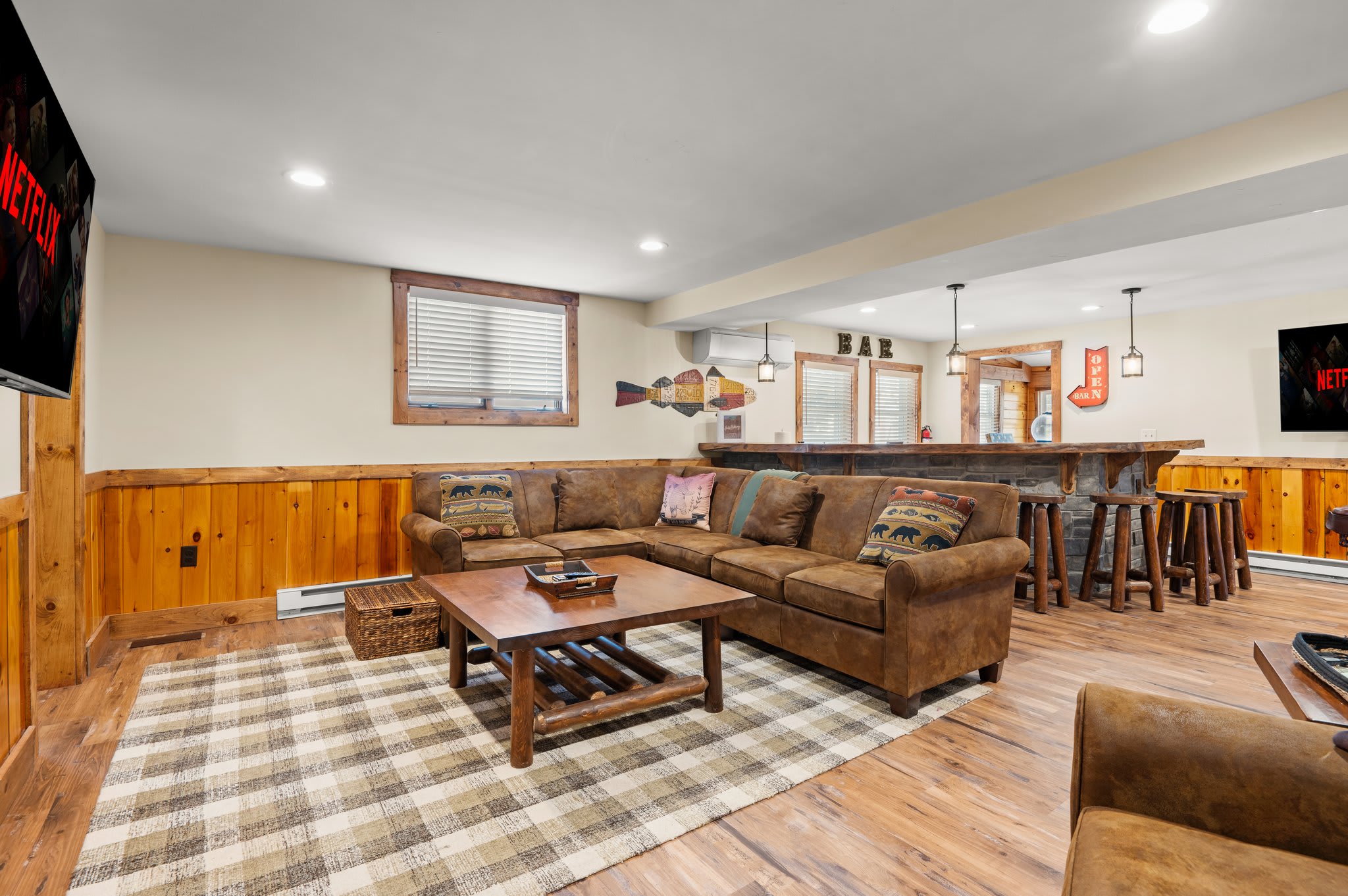 Laid-Back Living Area
Whether you're playing cards, watching a show, or catching up with friends, this warm lower-level space has room for everyone.