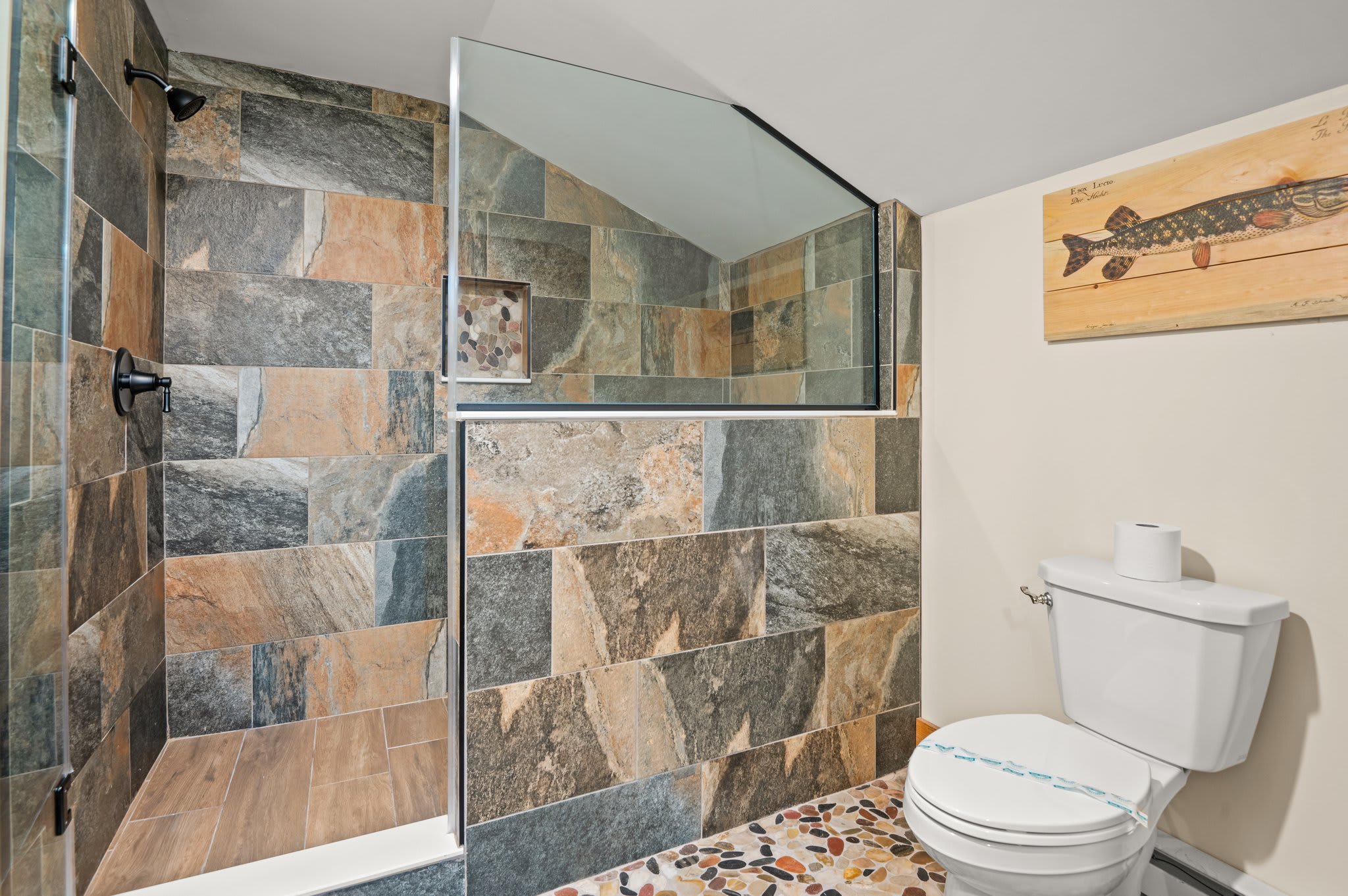 Rustic Stone Shower
This bathroom features a stunning walk-in stone shower and cozy cabin touches for a spa-like feel.
