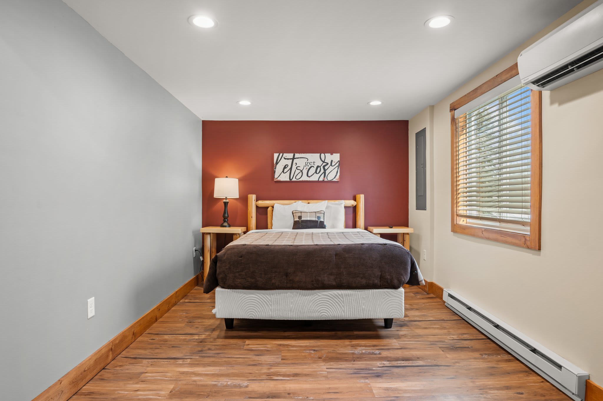 Modern Comfort Meets Cabin Vibe
A stylish accent wall and clean finishes make this bedroom perfect for relaxing in peace.