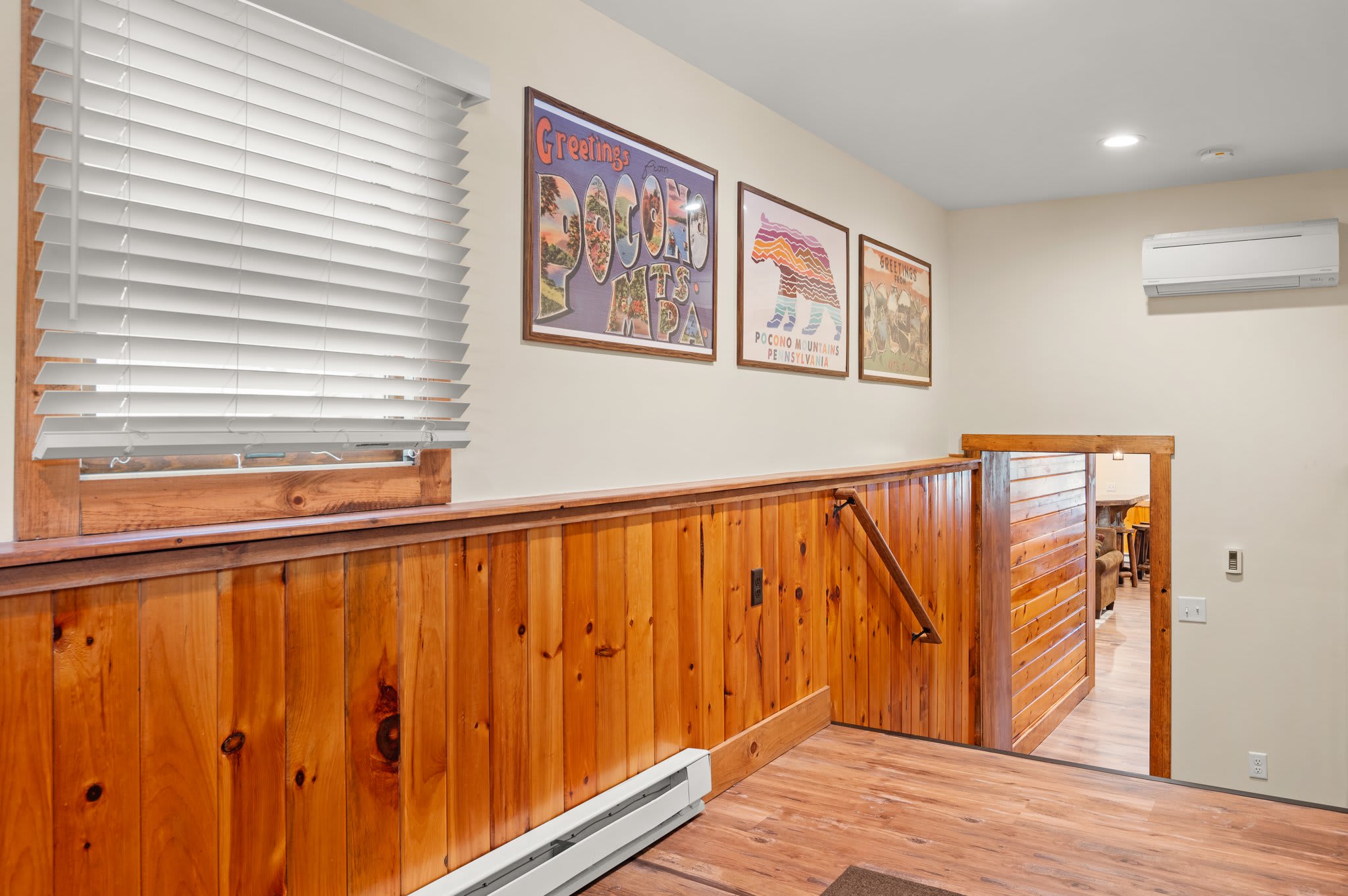 Wood-Toned Landing Area
This open space near the stairs keeps things bright and welcoming with plenty of natural light.