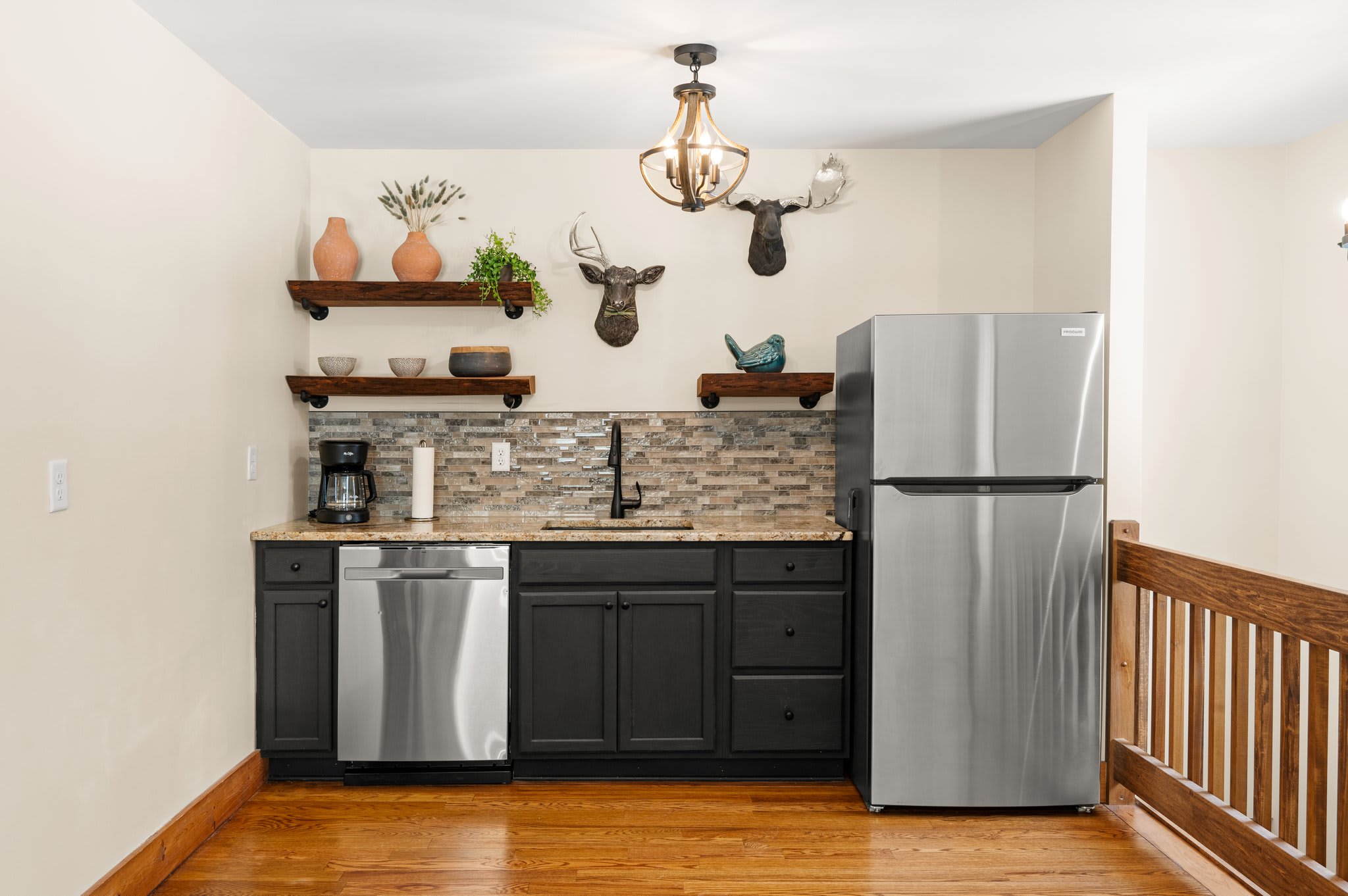 Upstairs Coffee and Bar Nook
A bonus kitchenette with fridge, coffee machine, and sink, perfect for late-night snacks or early morning brews.