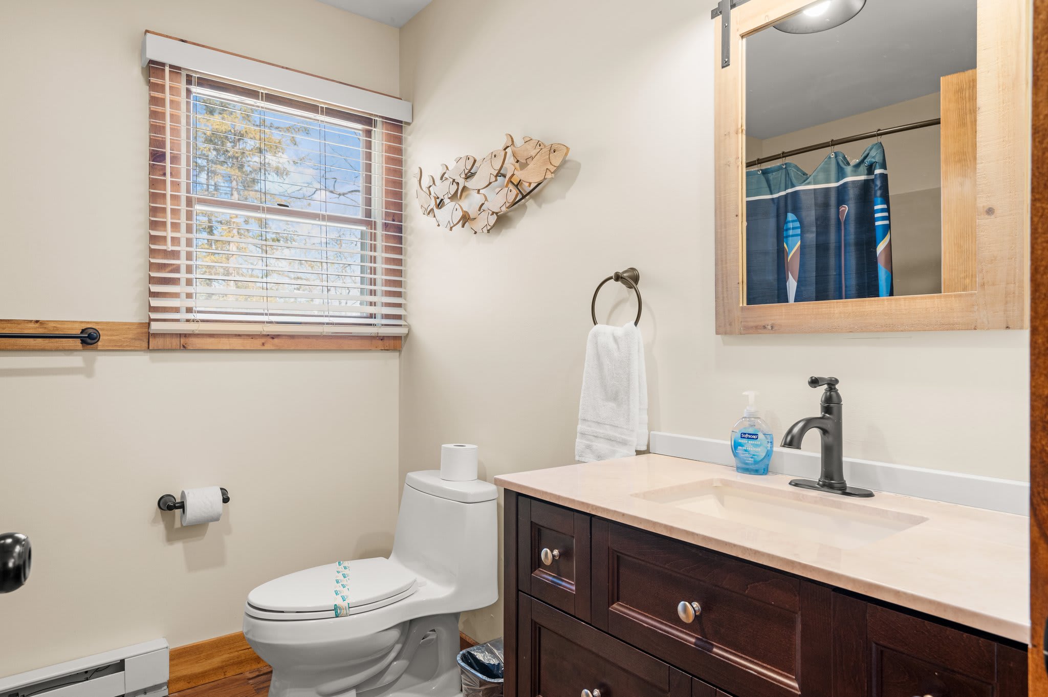 Warm Bathroom Touches
Wood details, soft lighting, and clean finishes make this bathroom feel both stylish and cozy.