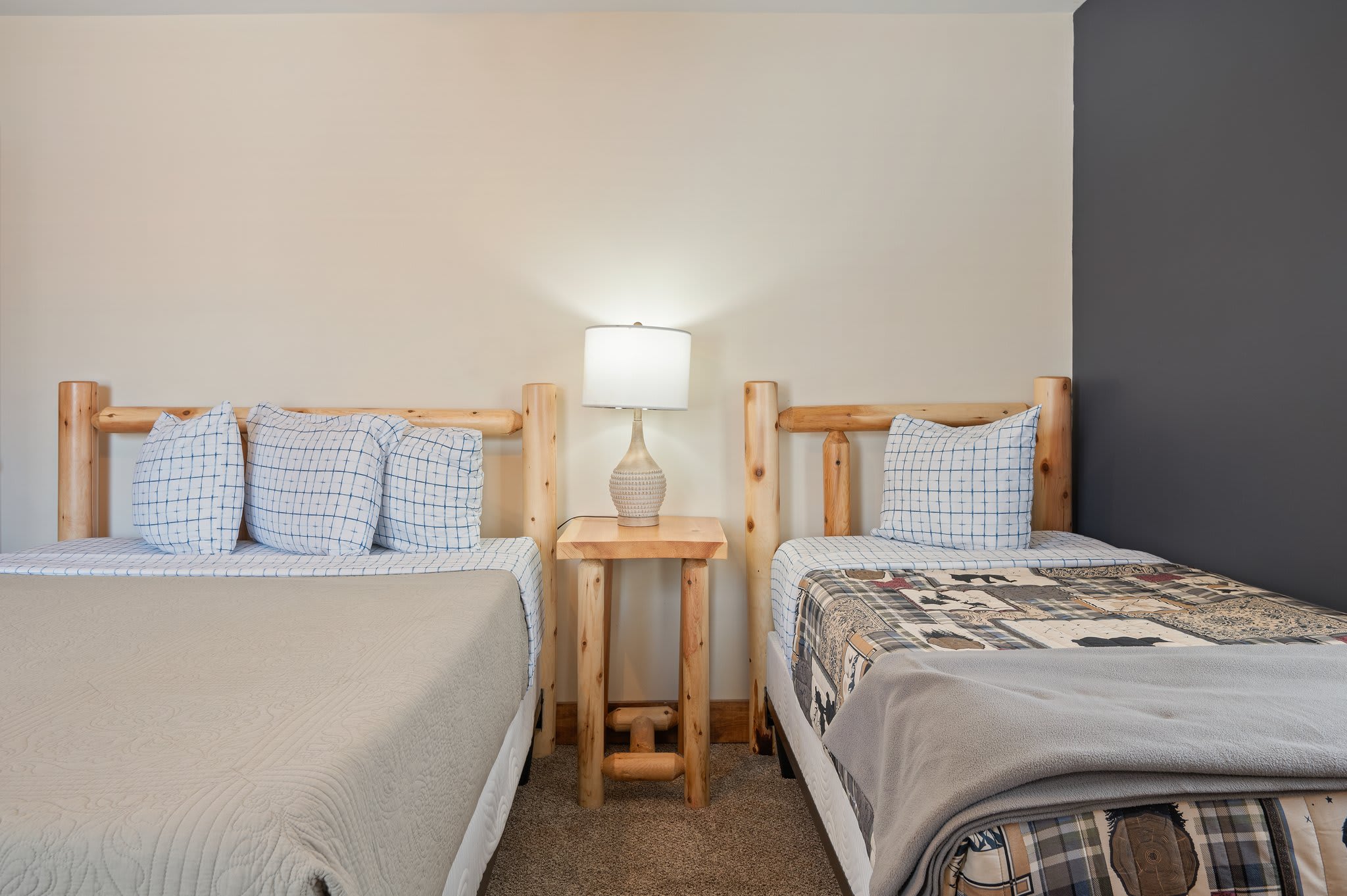 Bedroom with 1 Queen Bed & 1 Double Bed
A spacious layout with two cozy beds and soft lighting, ideal for relaxing after a day out.