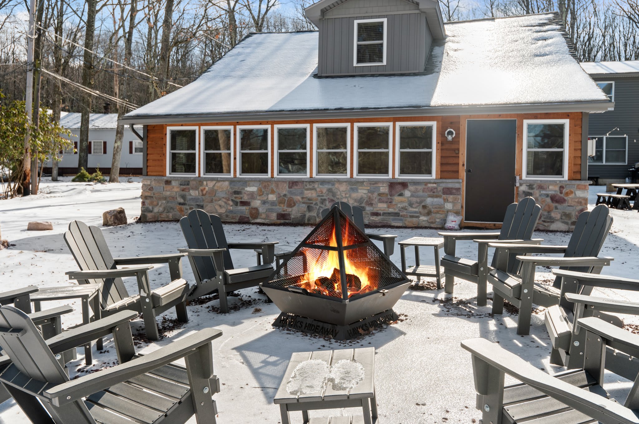 Fireside Memories Await
Gather around the fire pit for snowy night chats, marshmallows, and starry skies in this cozy backyard escape.