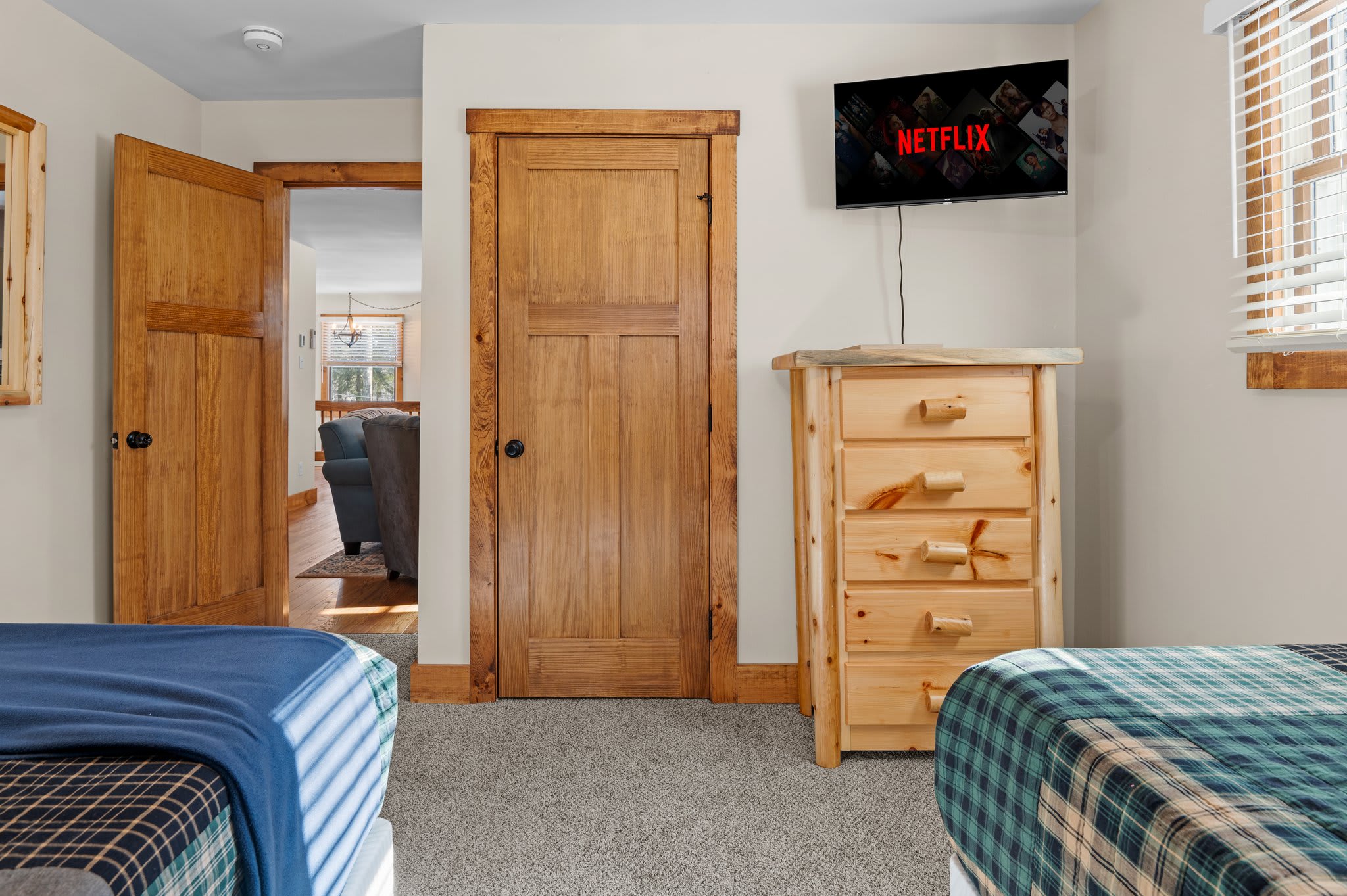 Comfort and Convenience
This guest-friendly bedroom includes extra storage, a wall-mounted TV, and peaceful privacy.