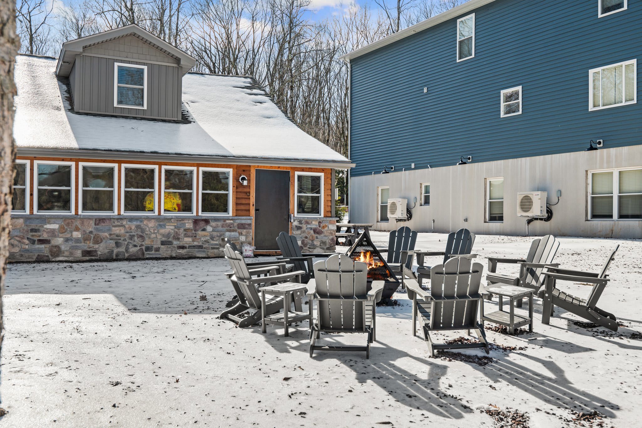 Winter-Ready Backyard
Gather around the fire pit in this spacious outdoor area, even in the snow, warm, cozy, and unforgettable.