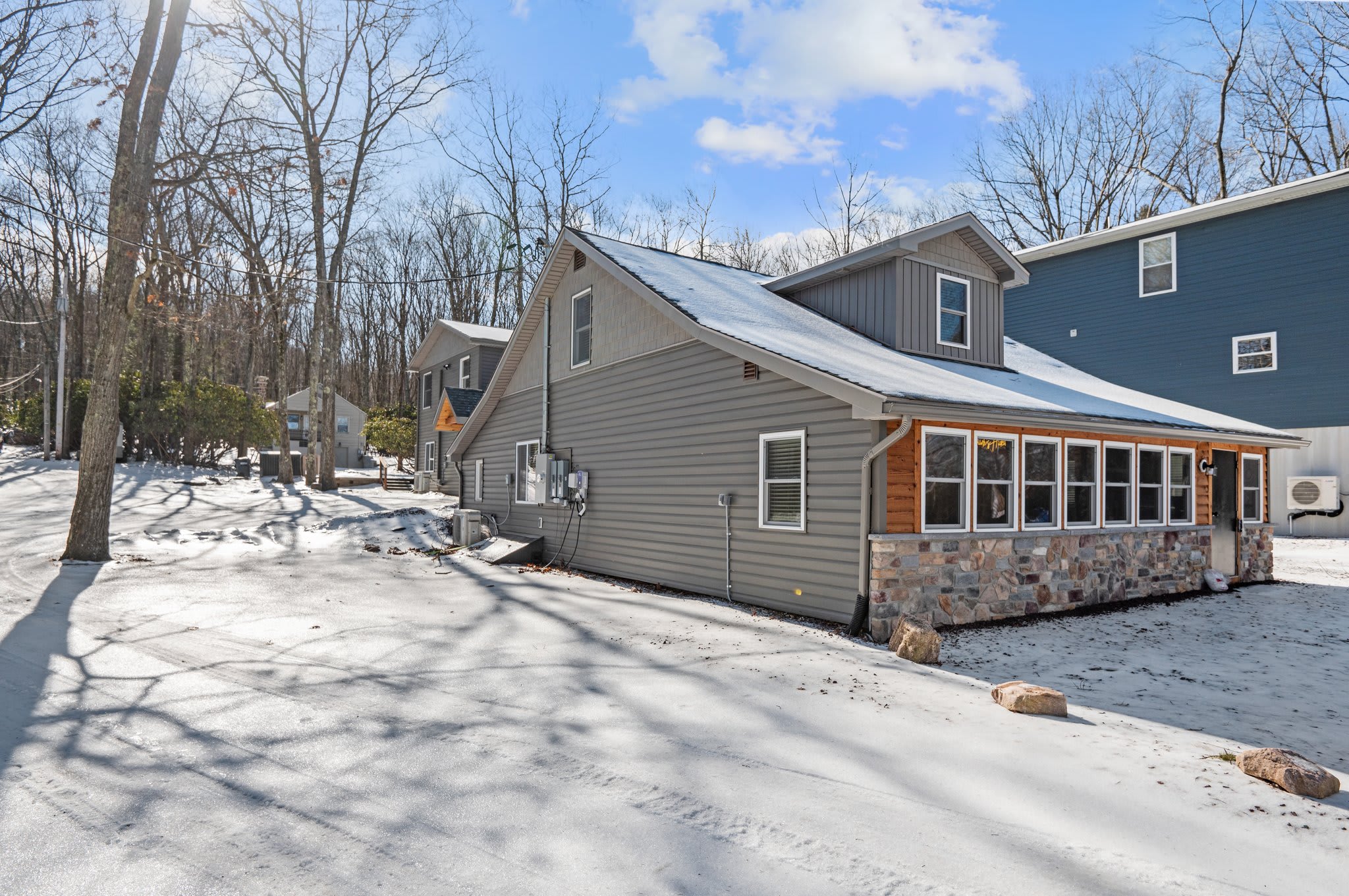 Peaceful Snowy Escape
This cozy cabin exterior looks even more magical blanketed in snow and surrounded by quiet woods.