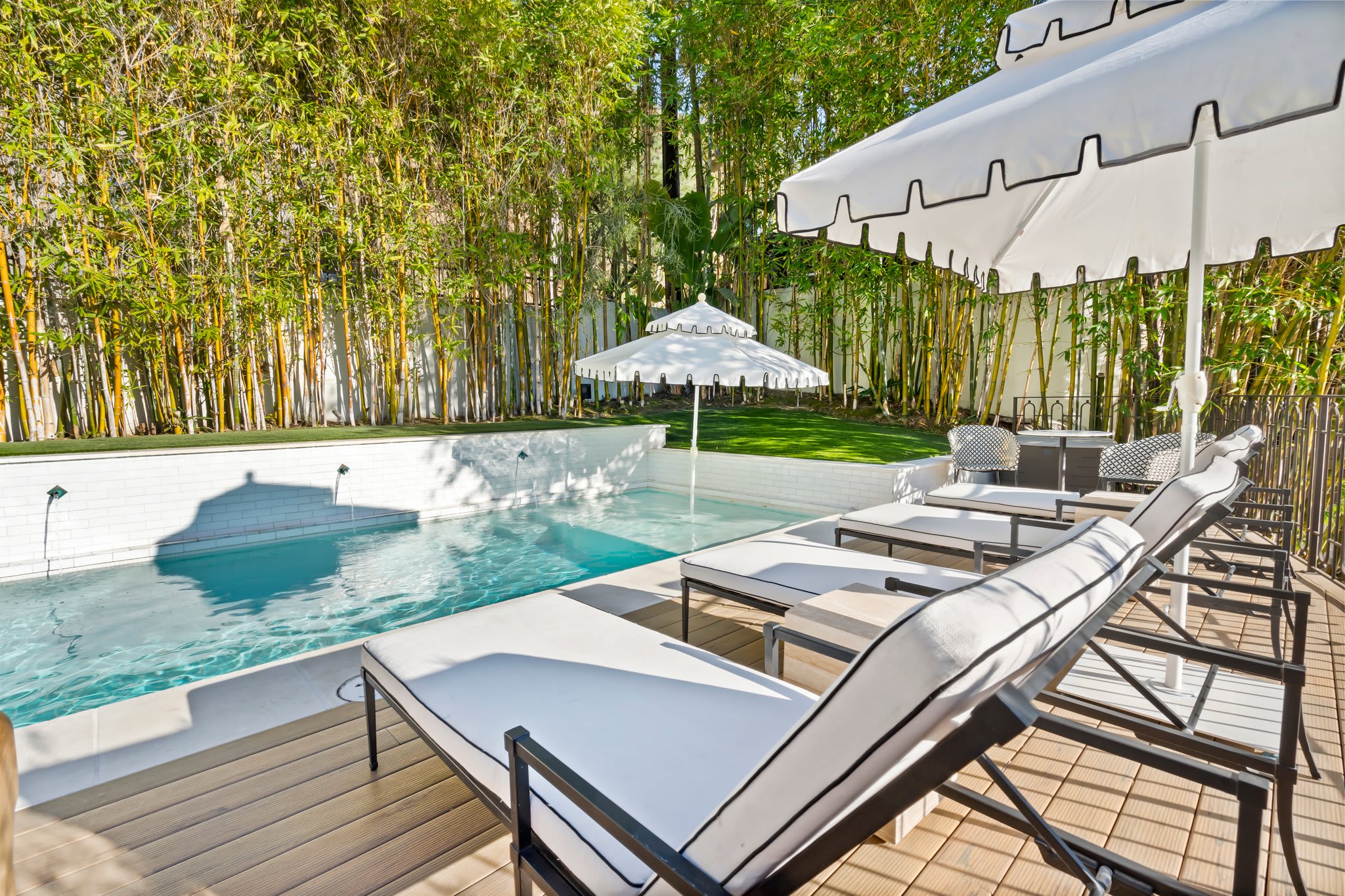Lounge in style with adjustable sunbeds and resort-inspired details.