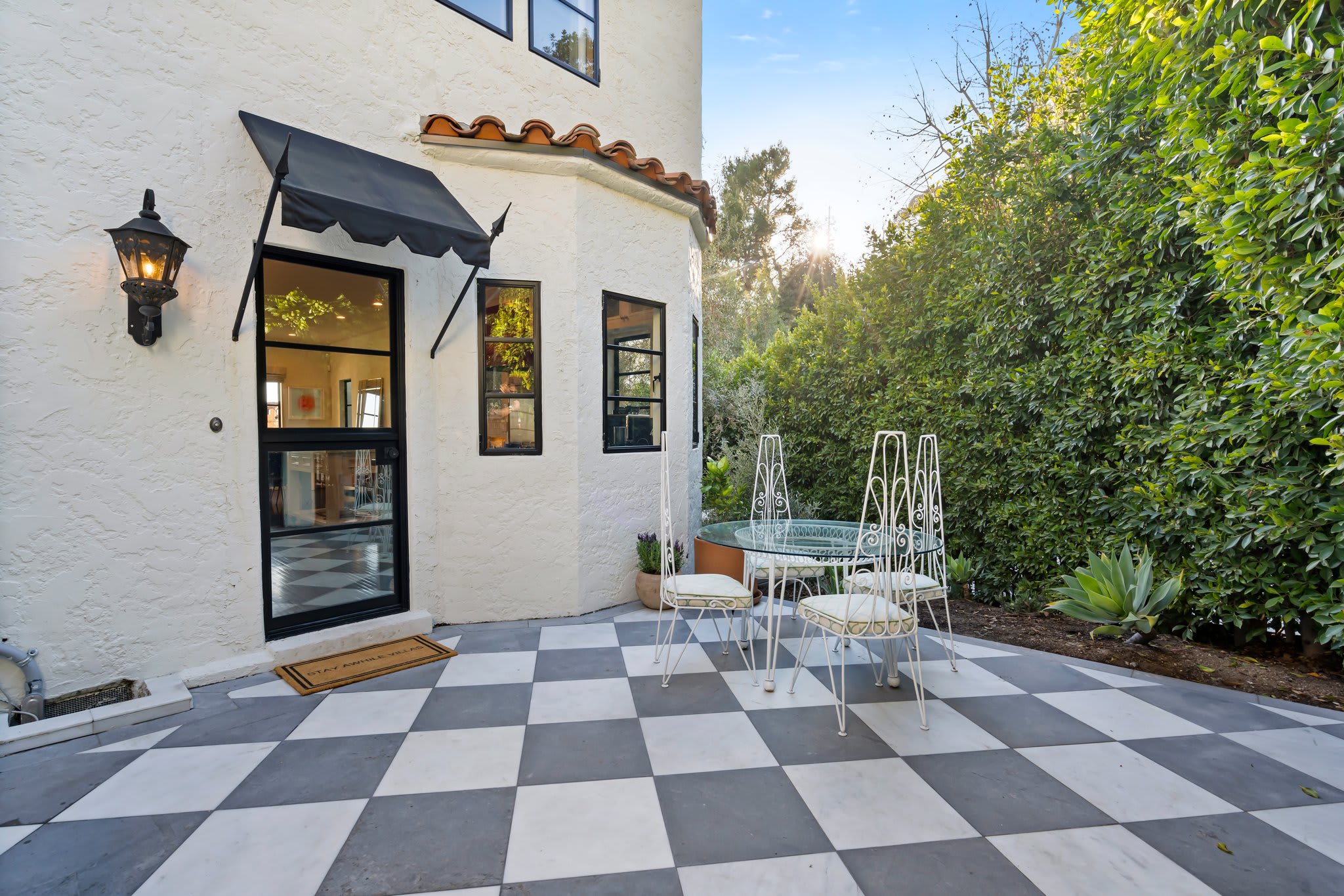 A sunlit courtyard where classic design meets effortless charm.