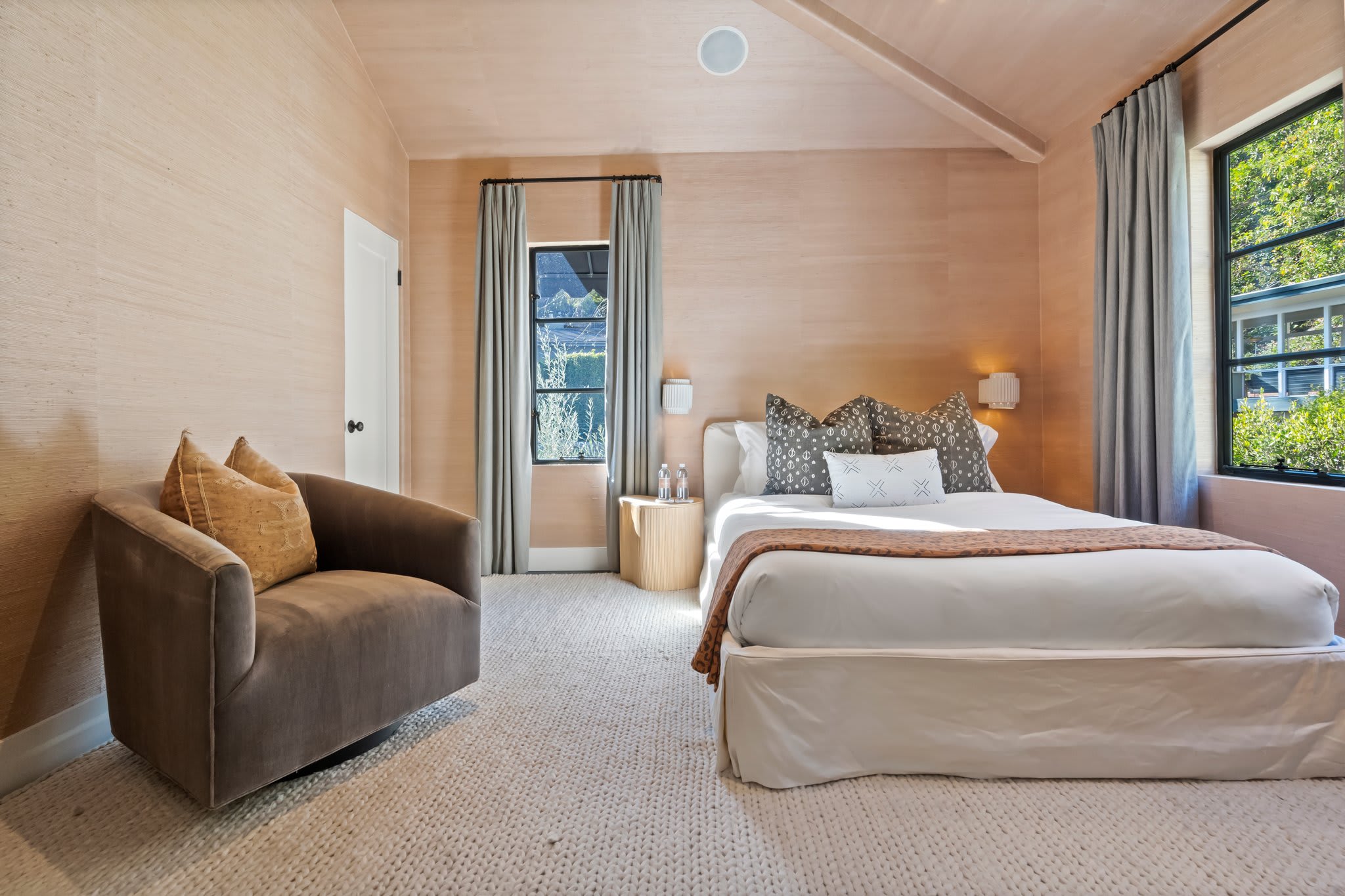 Every element, from the woven pillow to the premium bedding, is carefully chosen.