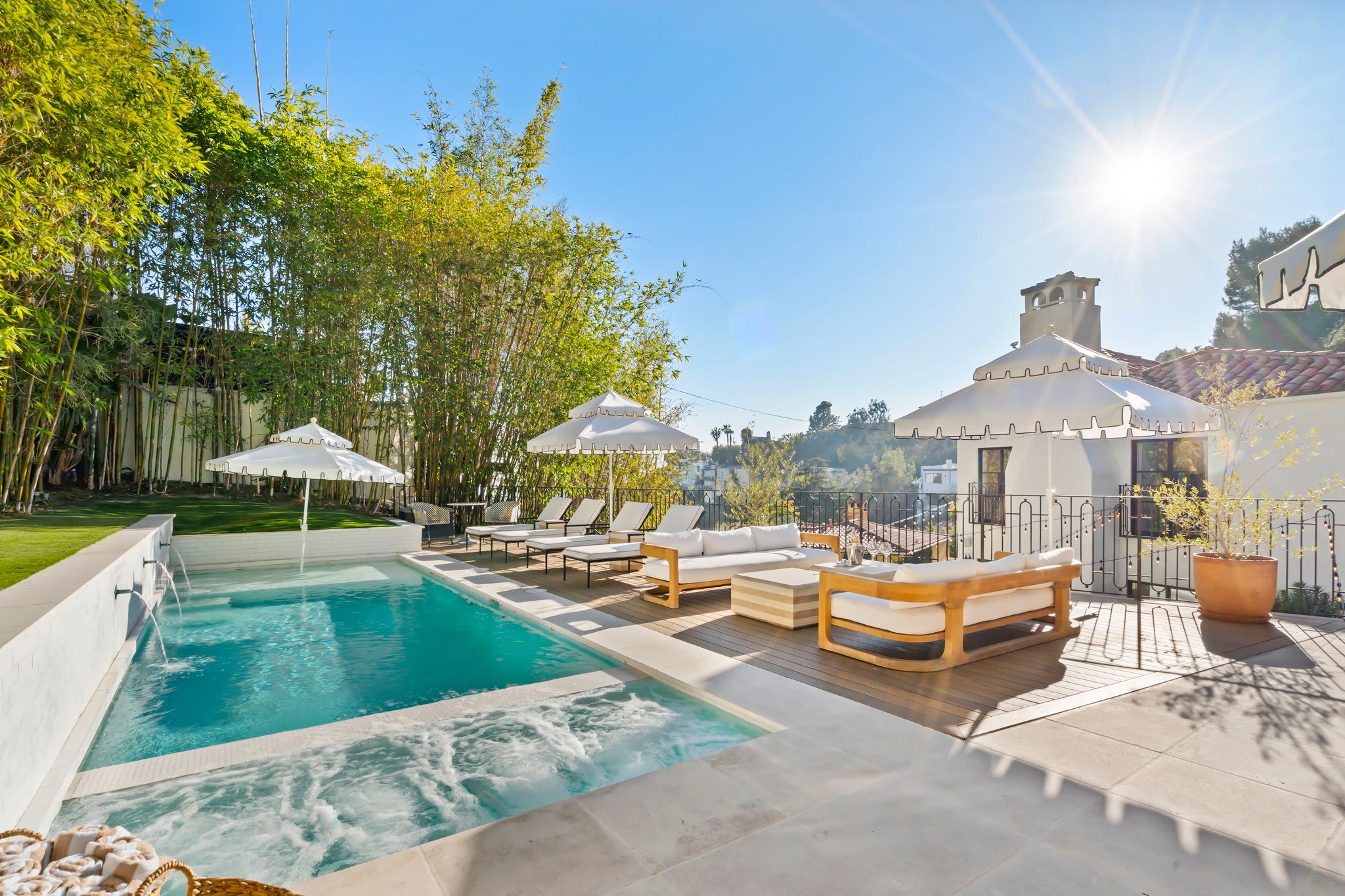 A private oasis with resort-style seating and a sun-drenched pool.