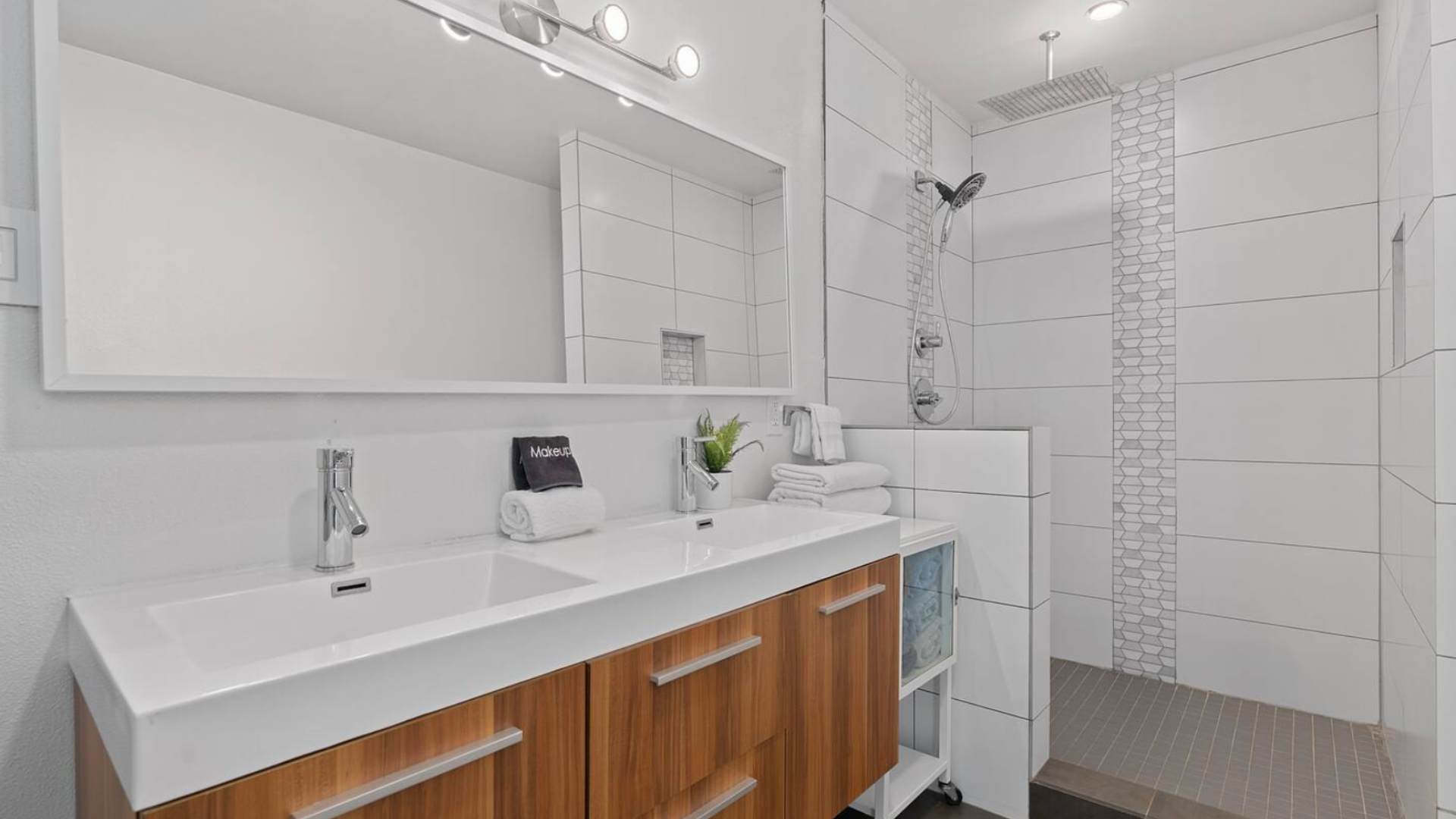 Full contemporary bathroom with double basin and spacious standing shower