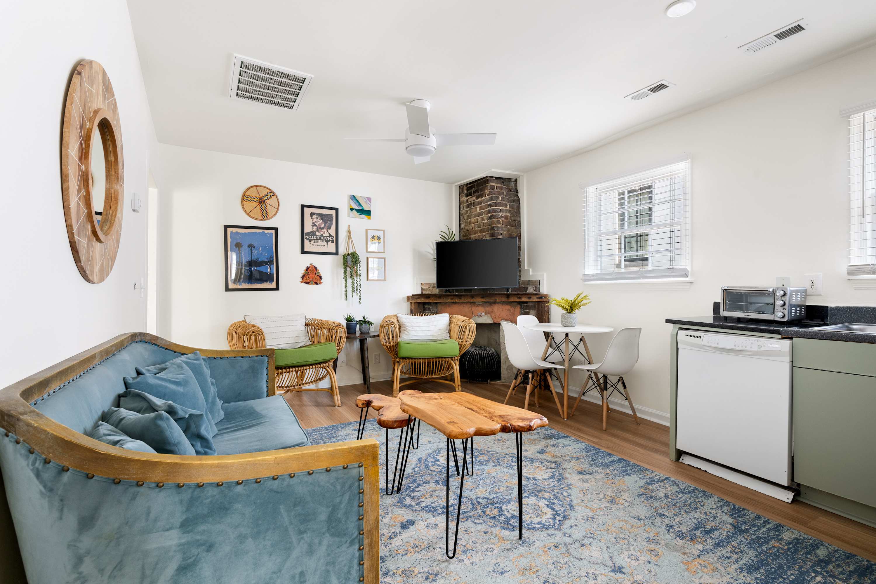 Open space layout featuring living room with plenty of seating space for your group, TV and kitchen with dining and seating for three