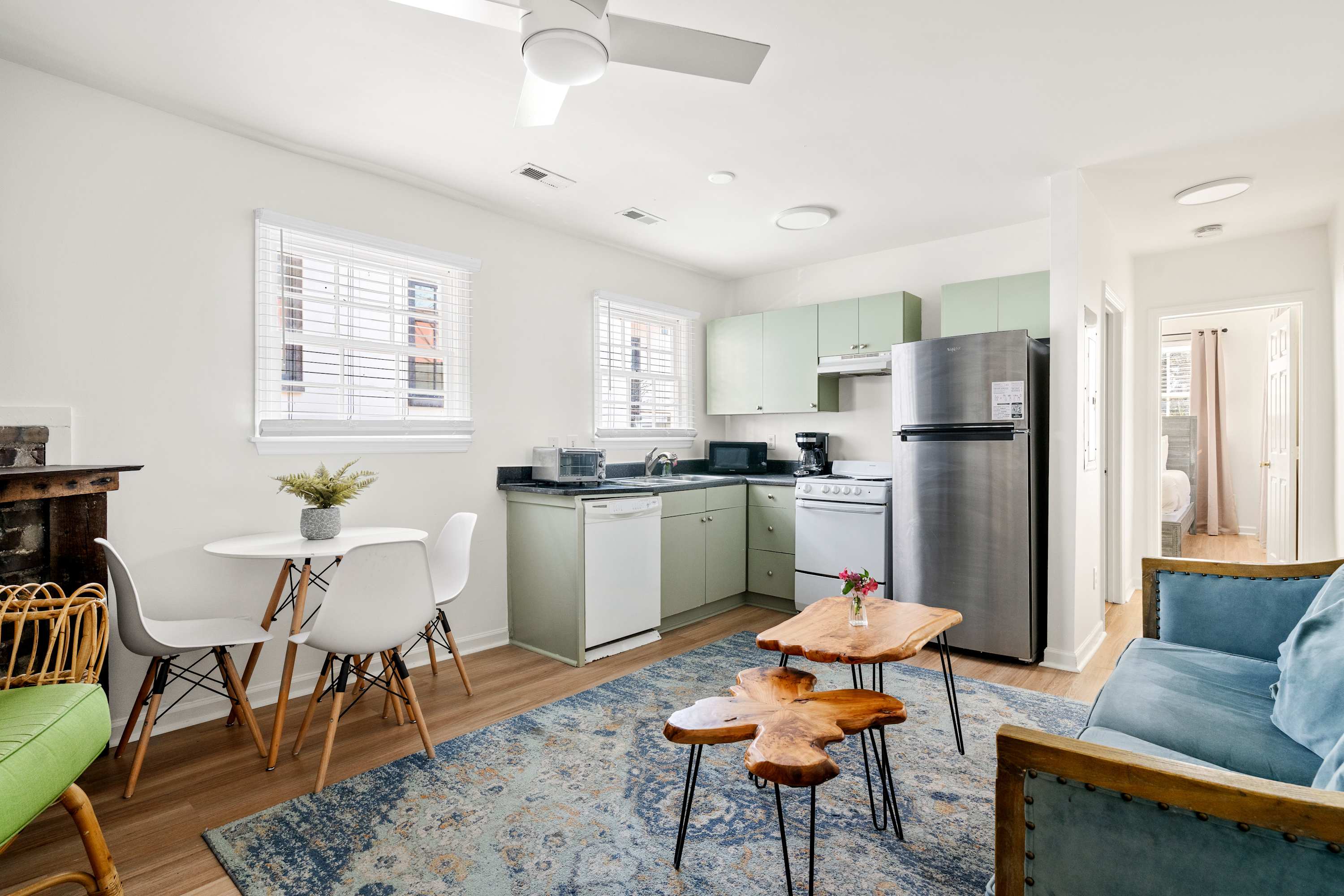 Open space layout featuring living room with plenty of seating space for your group, TV and kitchen with dining and seating for three