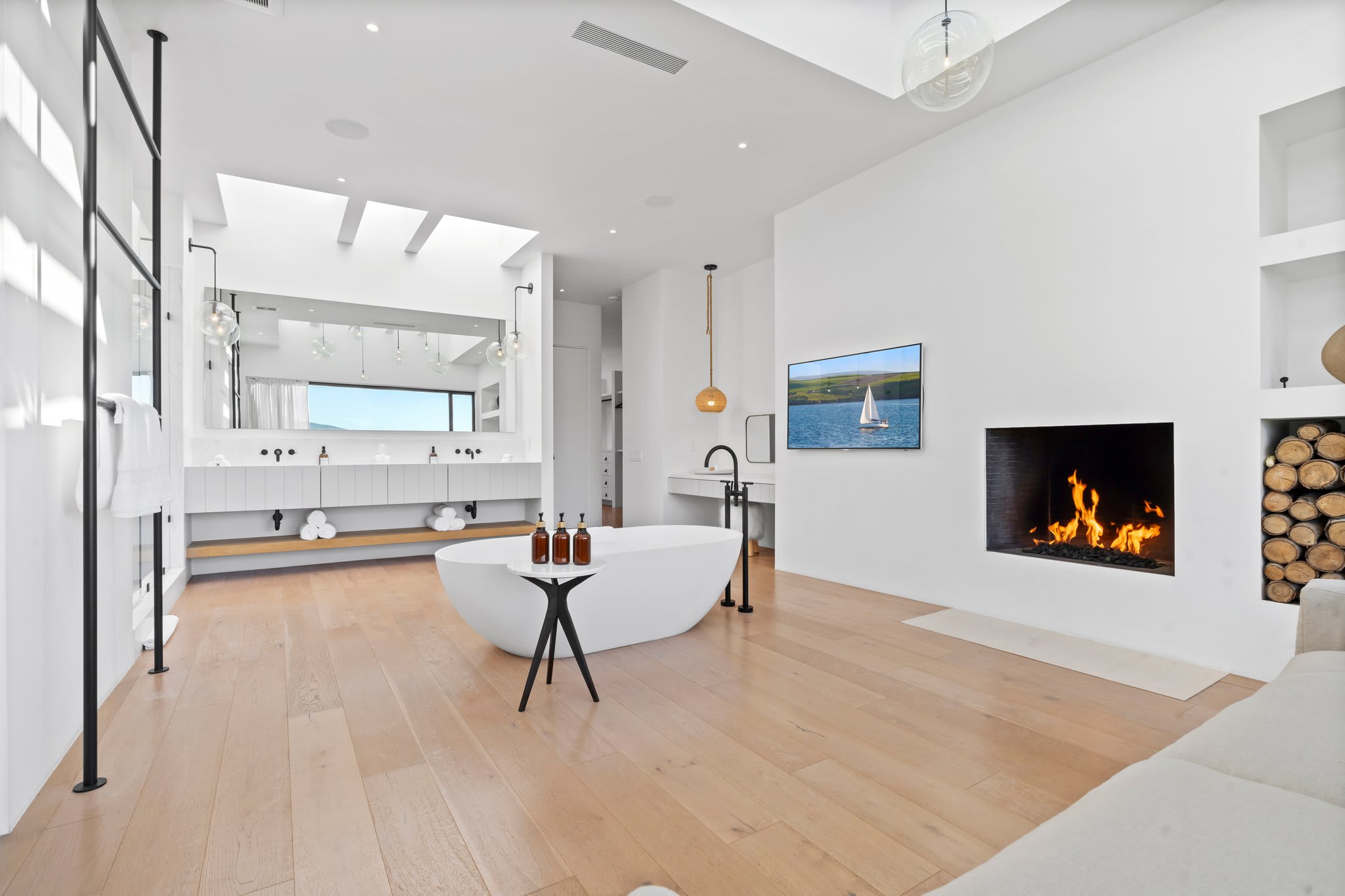 Soak in style with ocean views and a cozy fireplace at your side.