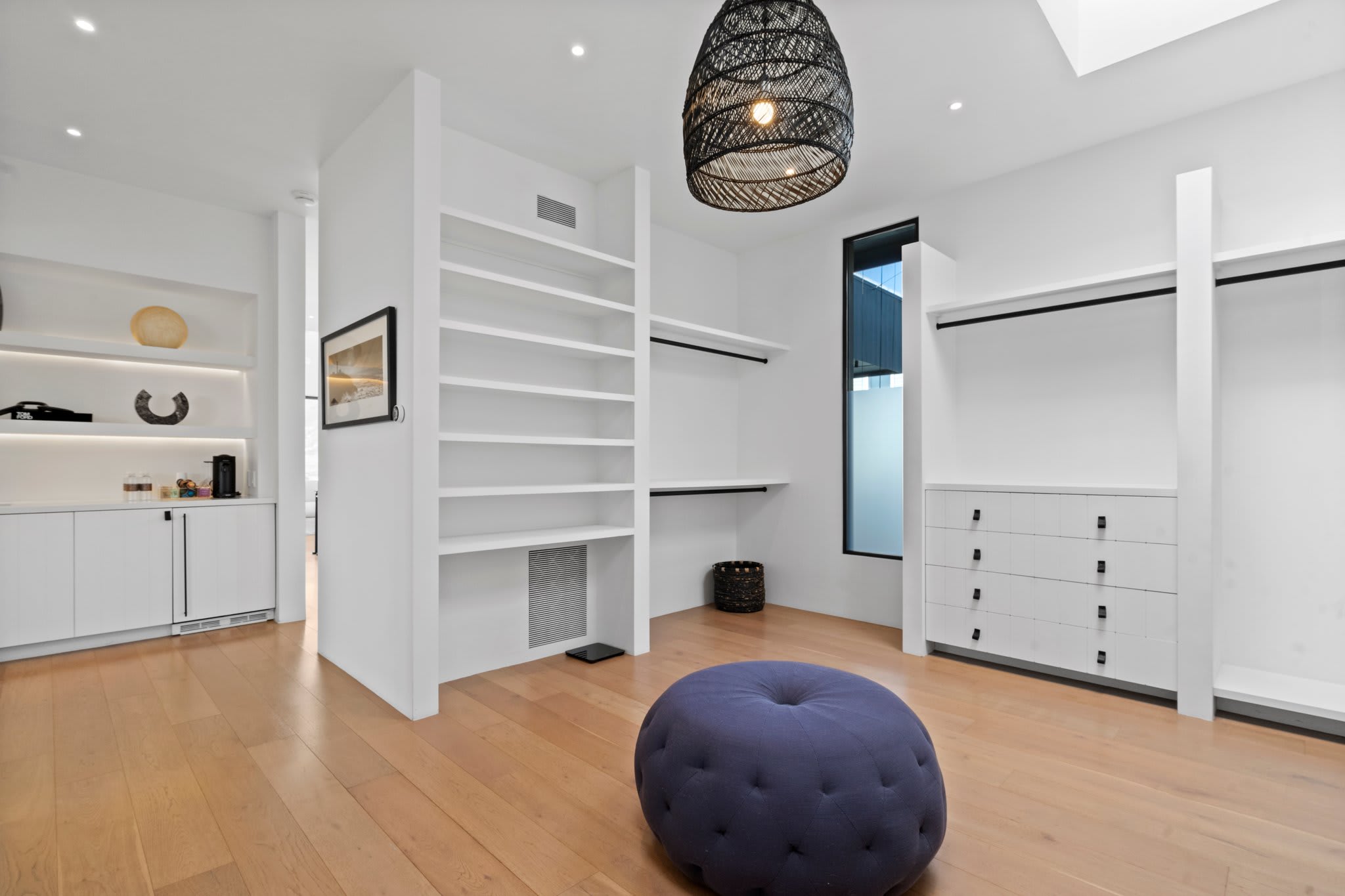 An elegant walk-in closet where everything has its perfect place.