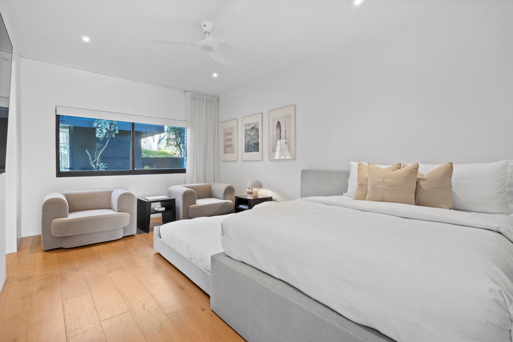 Designed for flexibility, this guest bedroom comfortably accommodates extra guests.